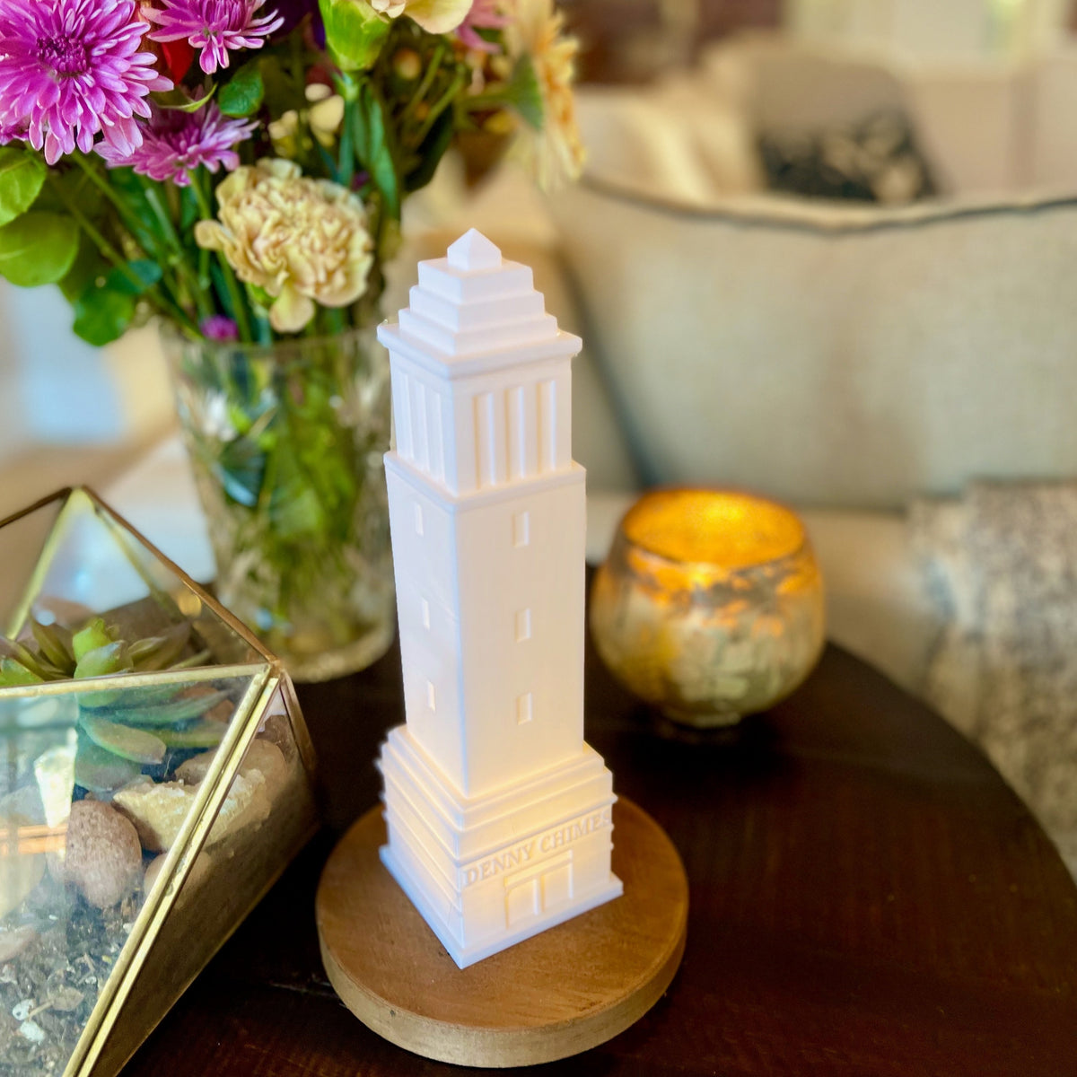 The University of Alabama Denny Chimes lamp, shown in use as home decor on a side table.