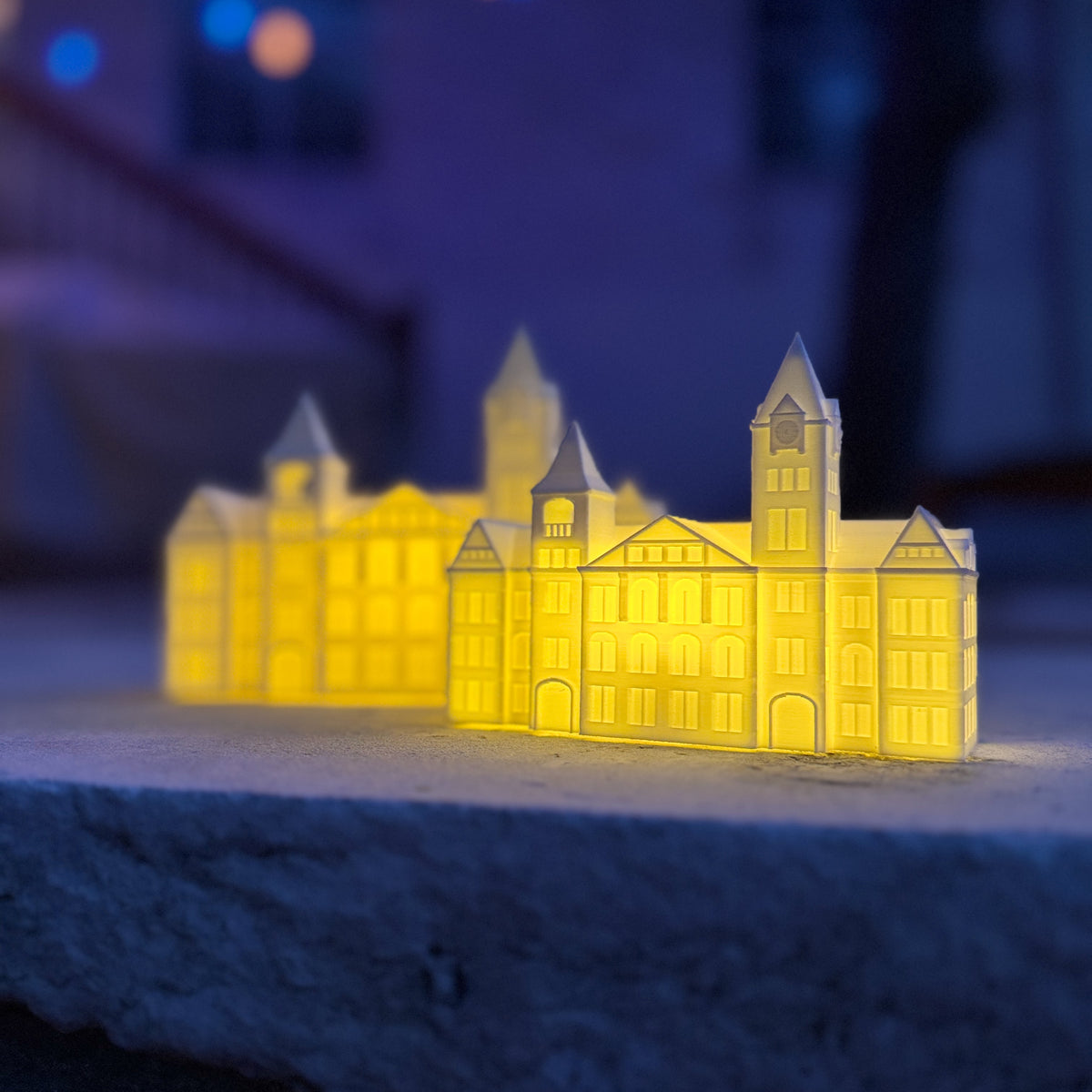 Auburn party decorations, two figurines with LED lights designed as the Samford Hall building.