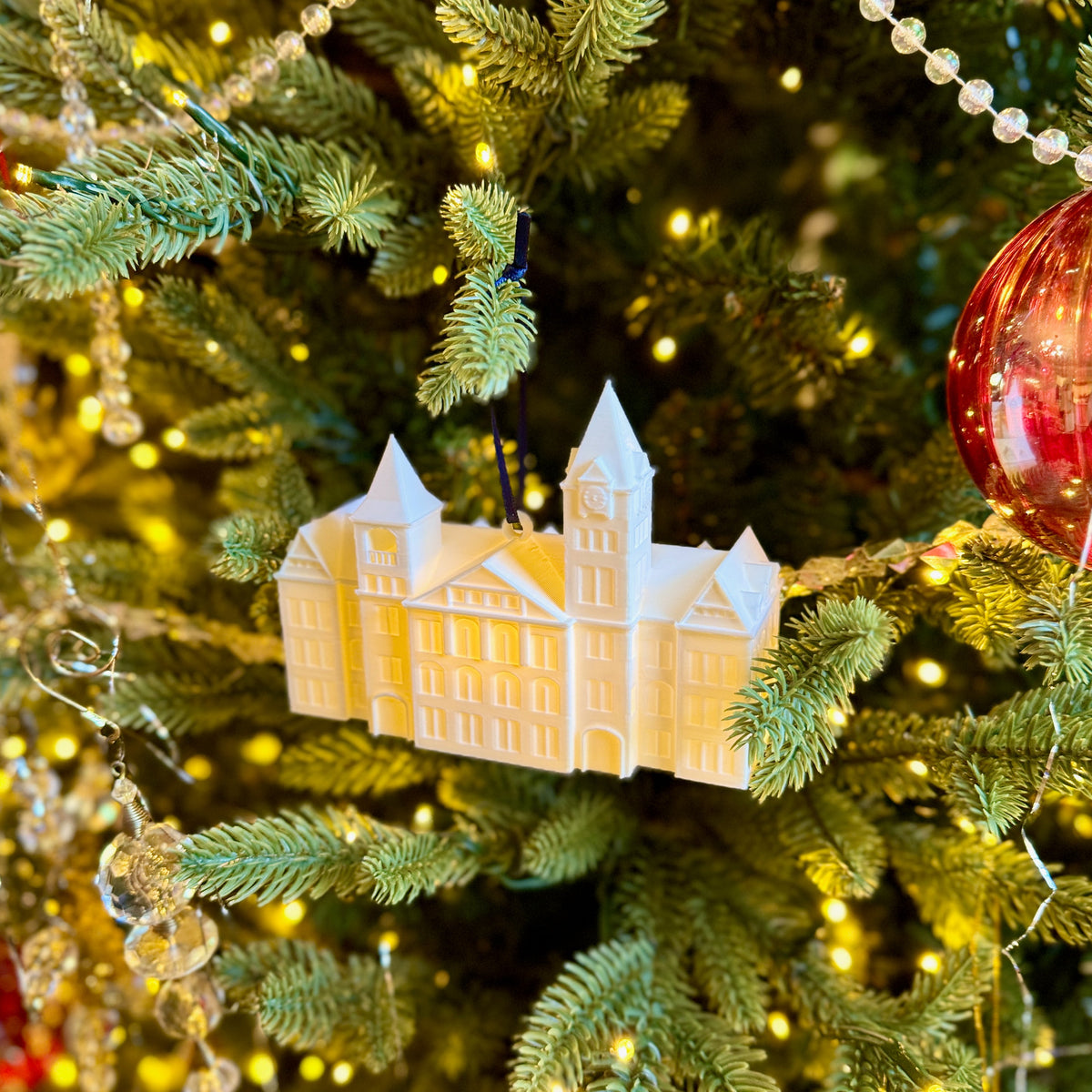 Side view of the Auburn keepsake ornament featuring Samford Hall.