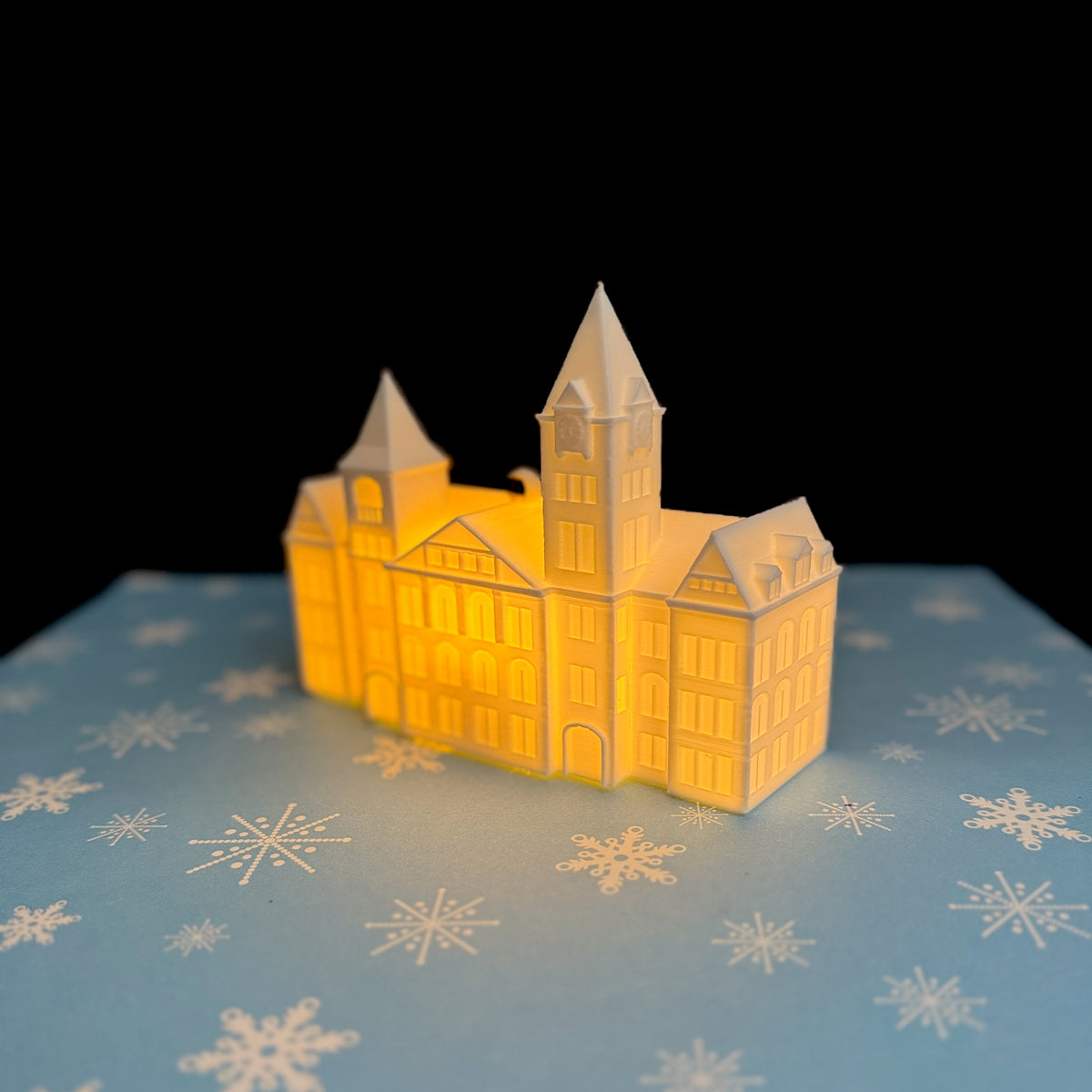 Festive Auburn Samford Hall ornament lit with warm LED glow — great gift for college students and fans.