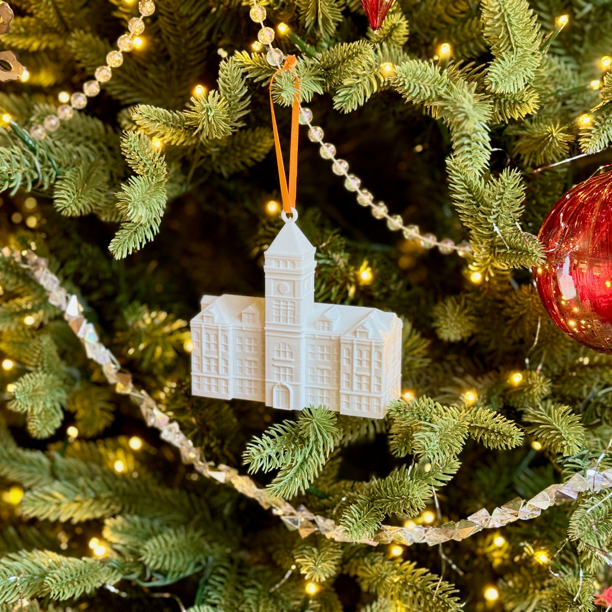 Clemson alumni ornament shown on a Christmas tree.