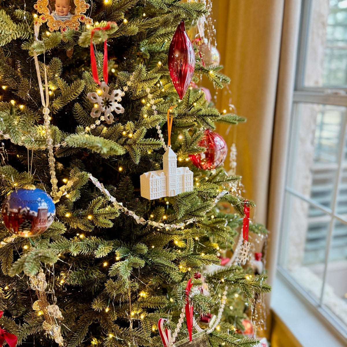 Clemson alumni ornament shown on a Christmas tree.
