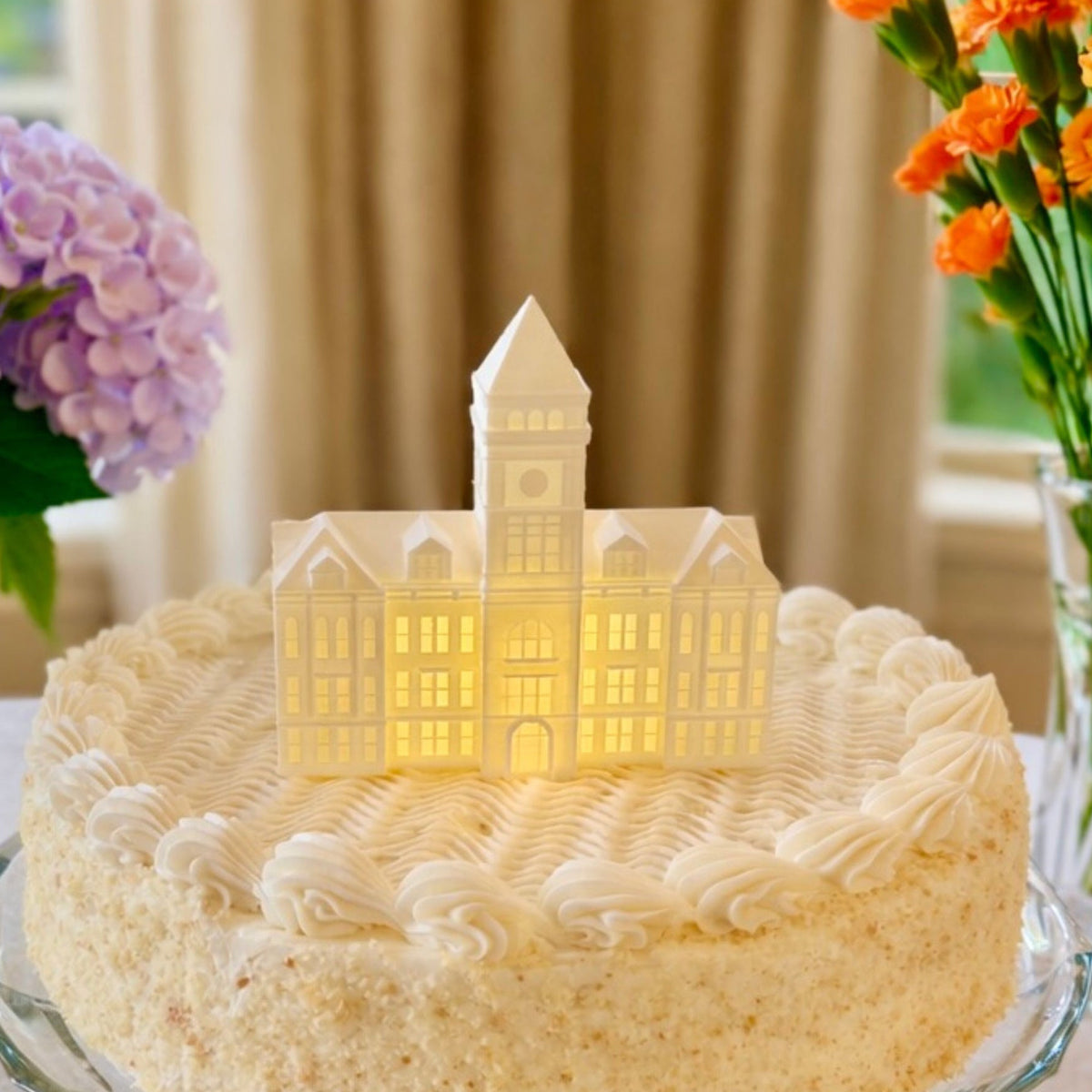 The Clemson cake topper figurine, shown on a graduation or groom's cake for a Clemson alumni.