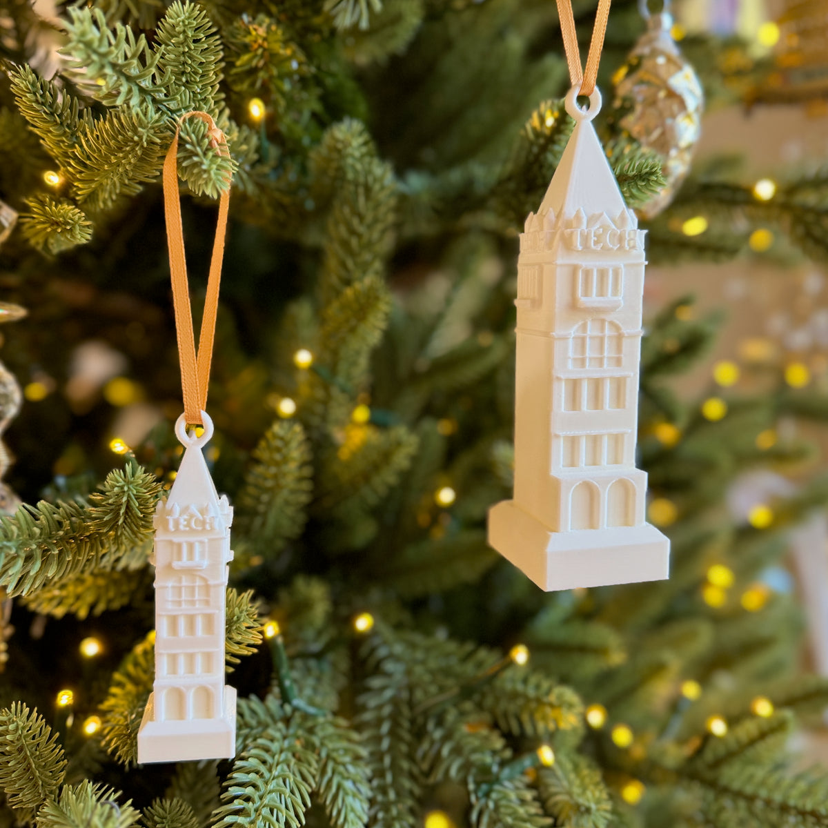 The Georgia Tech Tower ornaments, shown side by side on a Christmas tree.