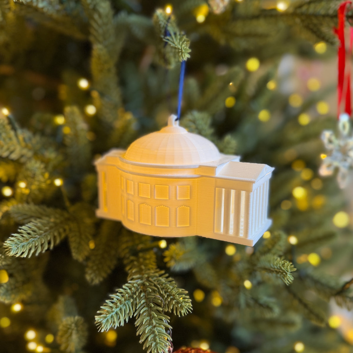 Side view of the UVA Rotunda ornament, shown on a Christmas tree.