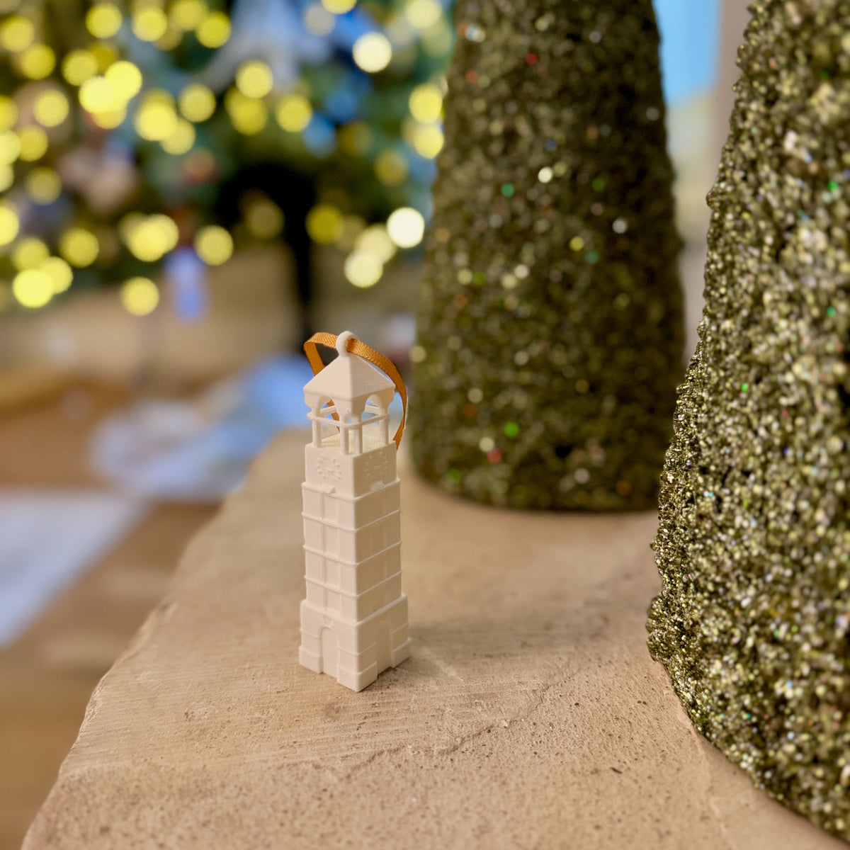 Purdue keepsake ornament of the bell tower, shown in a home decorated for the Holidays.
