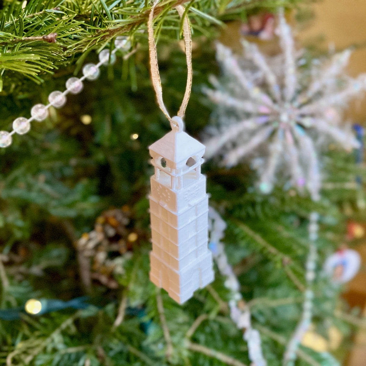 The Purdue Christmas decoration, shown on a Purdue tree.