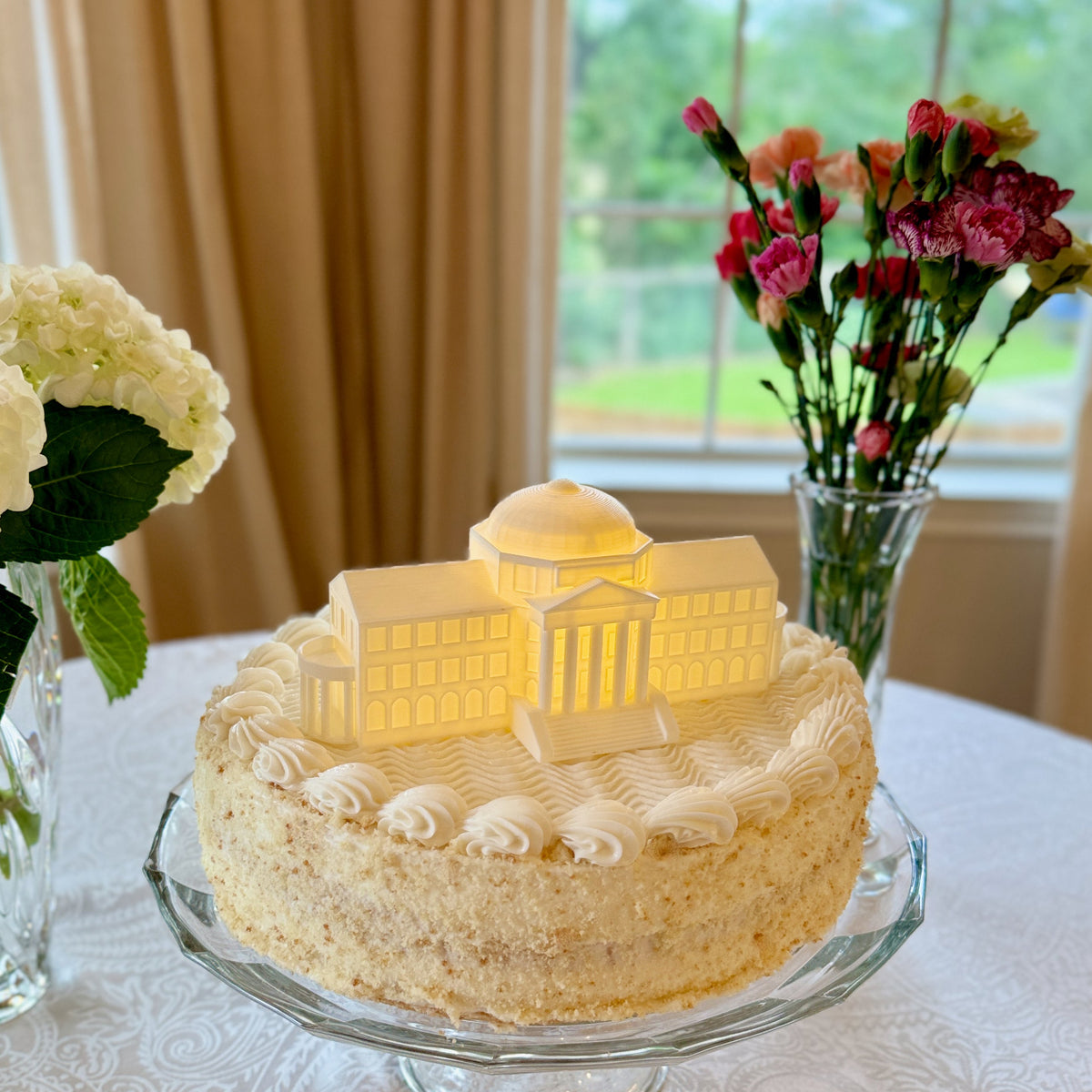 The SMU college cake topper, shown on a graduation cake.