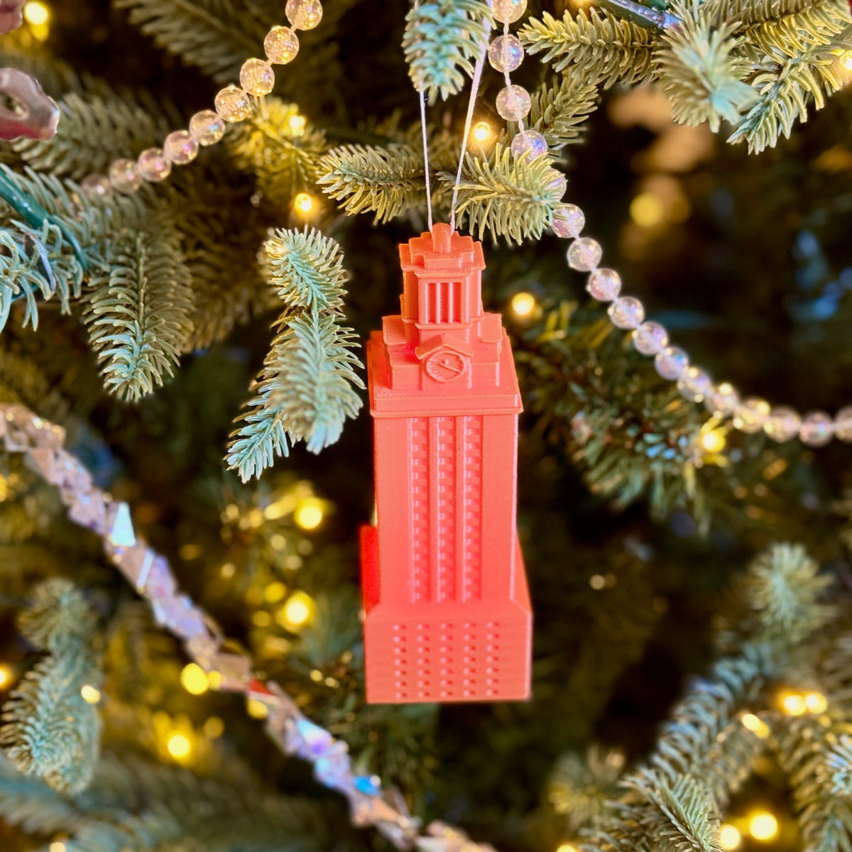 UT Austin ornament in burnt orange, depicting the University of Texas Tower.