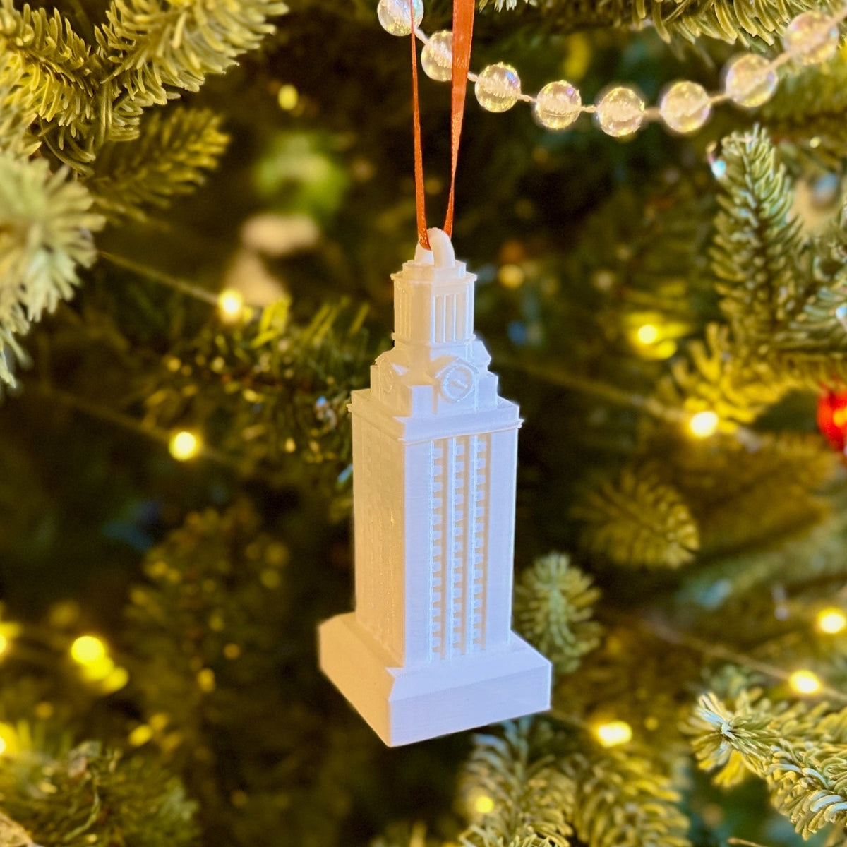 The UT Tower ornament, shown in white.