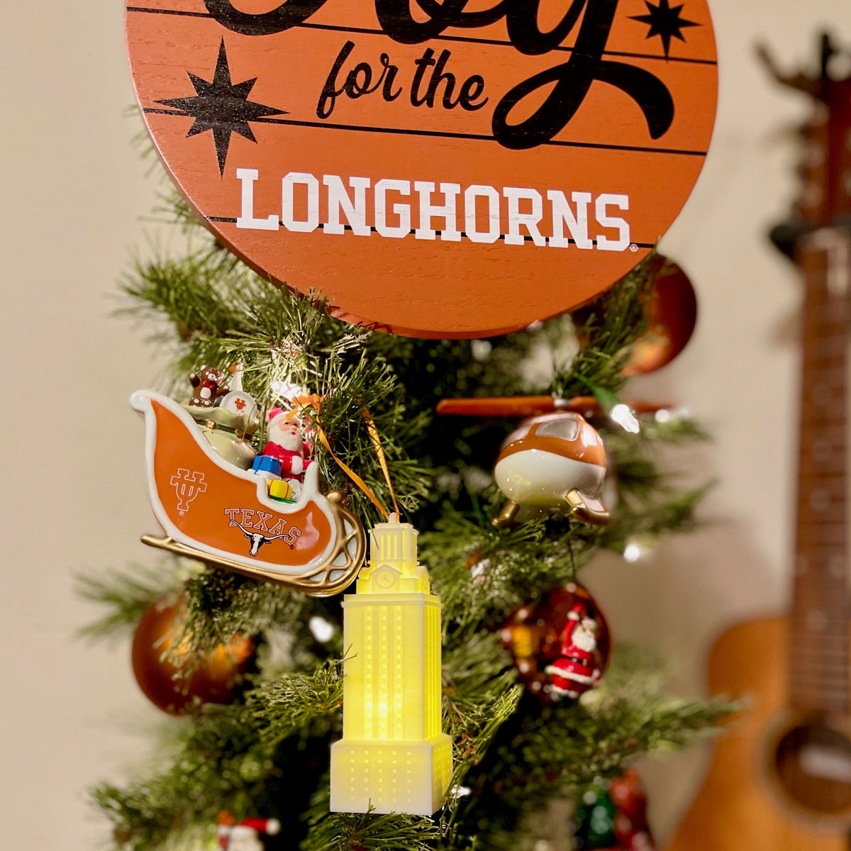 The UT Tower lighted ornament, shown on a University of Texas tree.