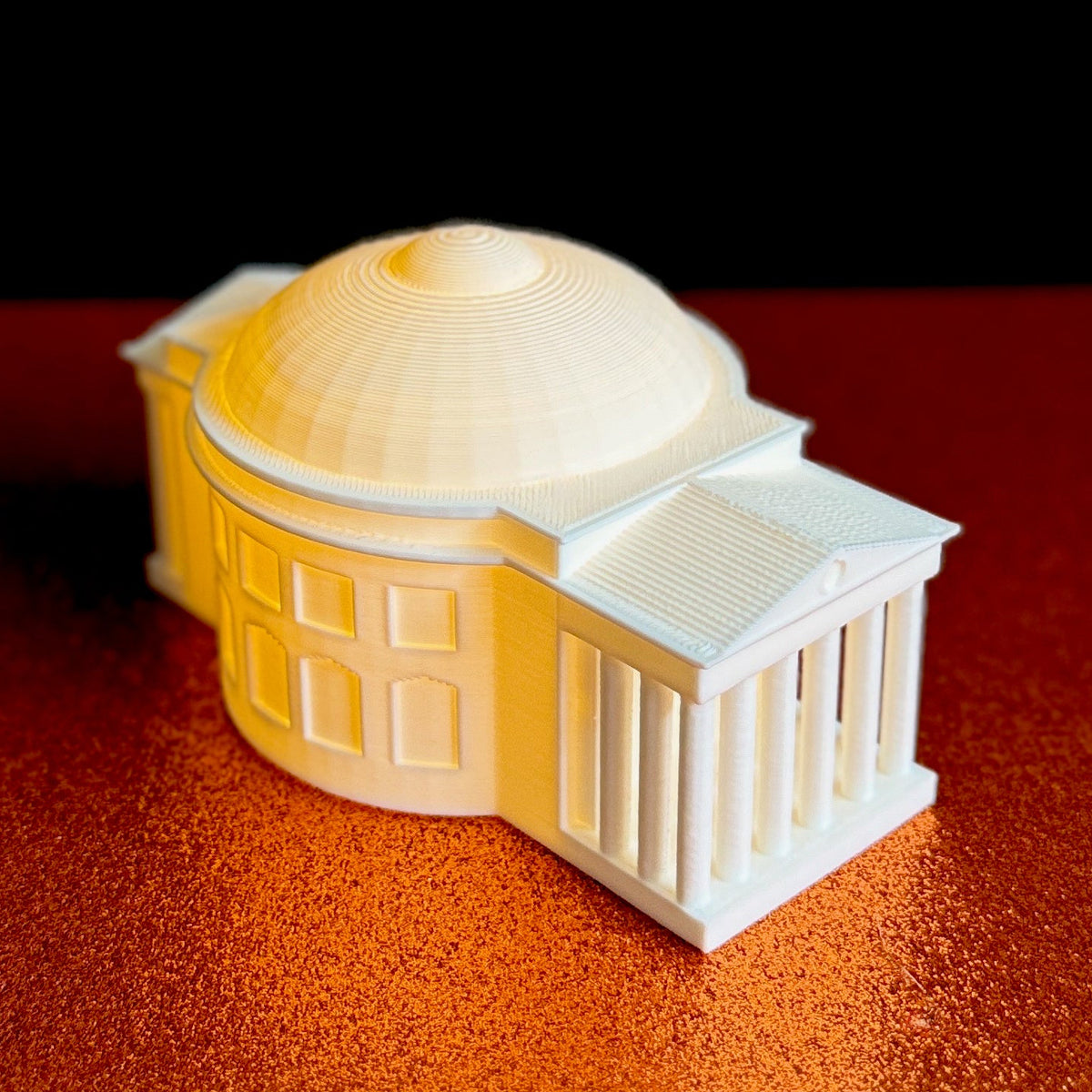 Side view of the lighted UVA party decoration, designed to look like the UVA Rotunda.