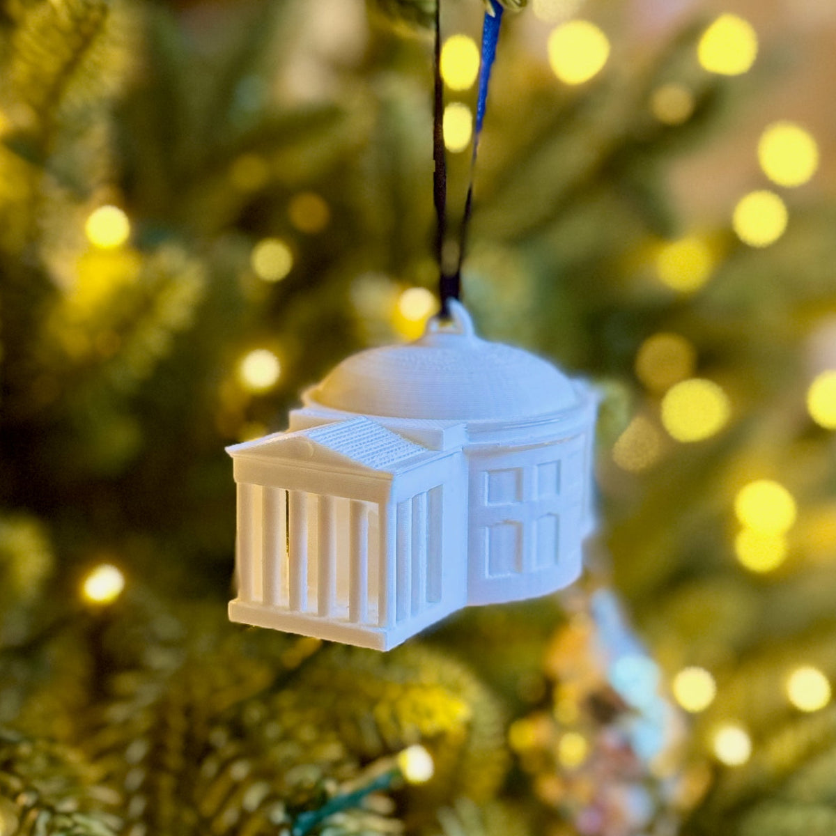 The UVA ornament shown on a Christmas tree.