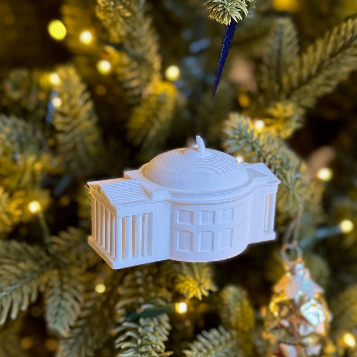 The UVA college ornament, shown on a UVA tree.