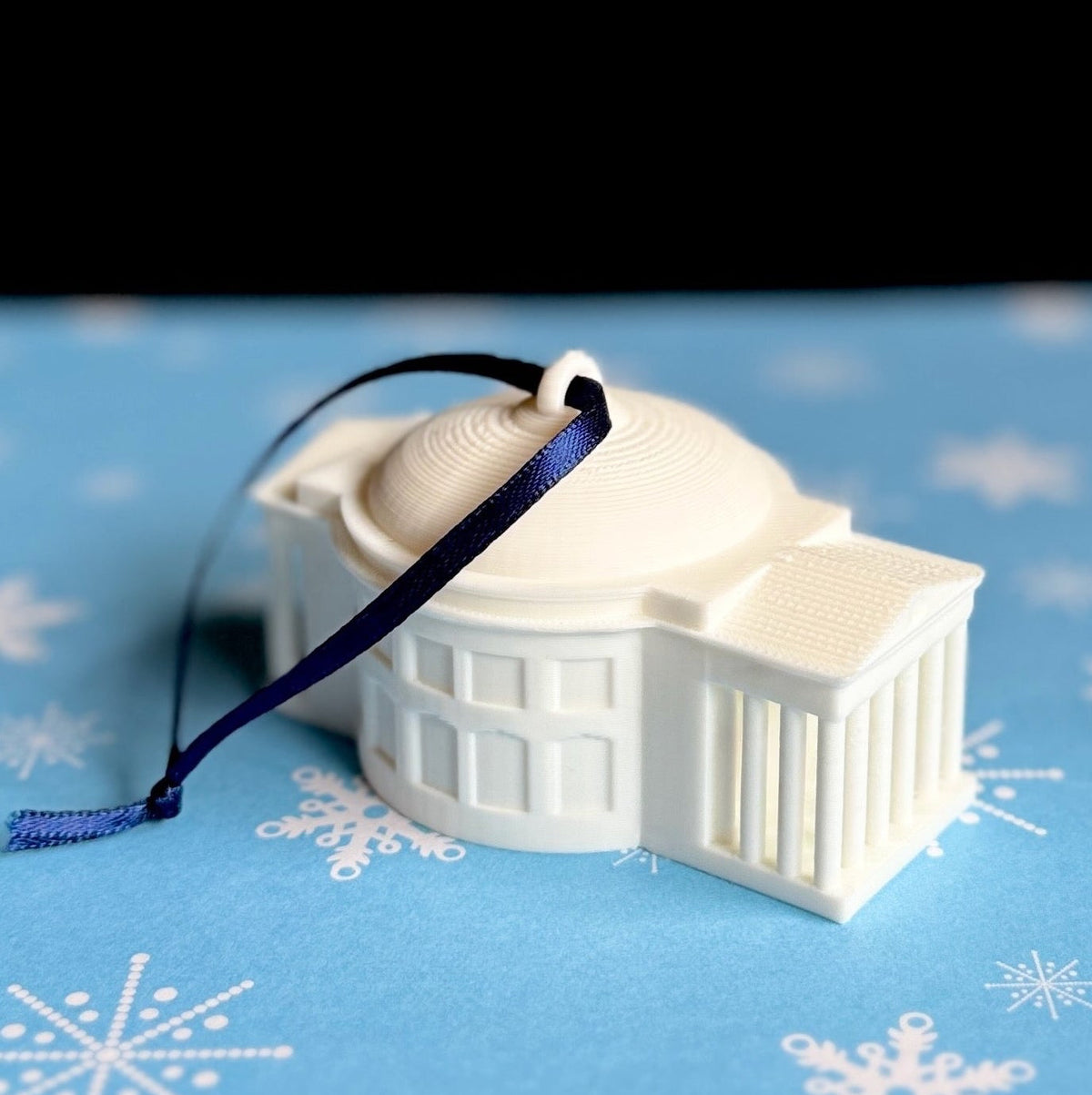 University of Virginia Rotunda ornament, shown against a holiday background.