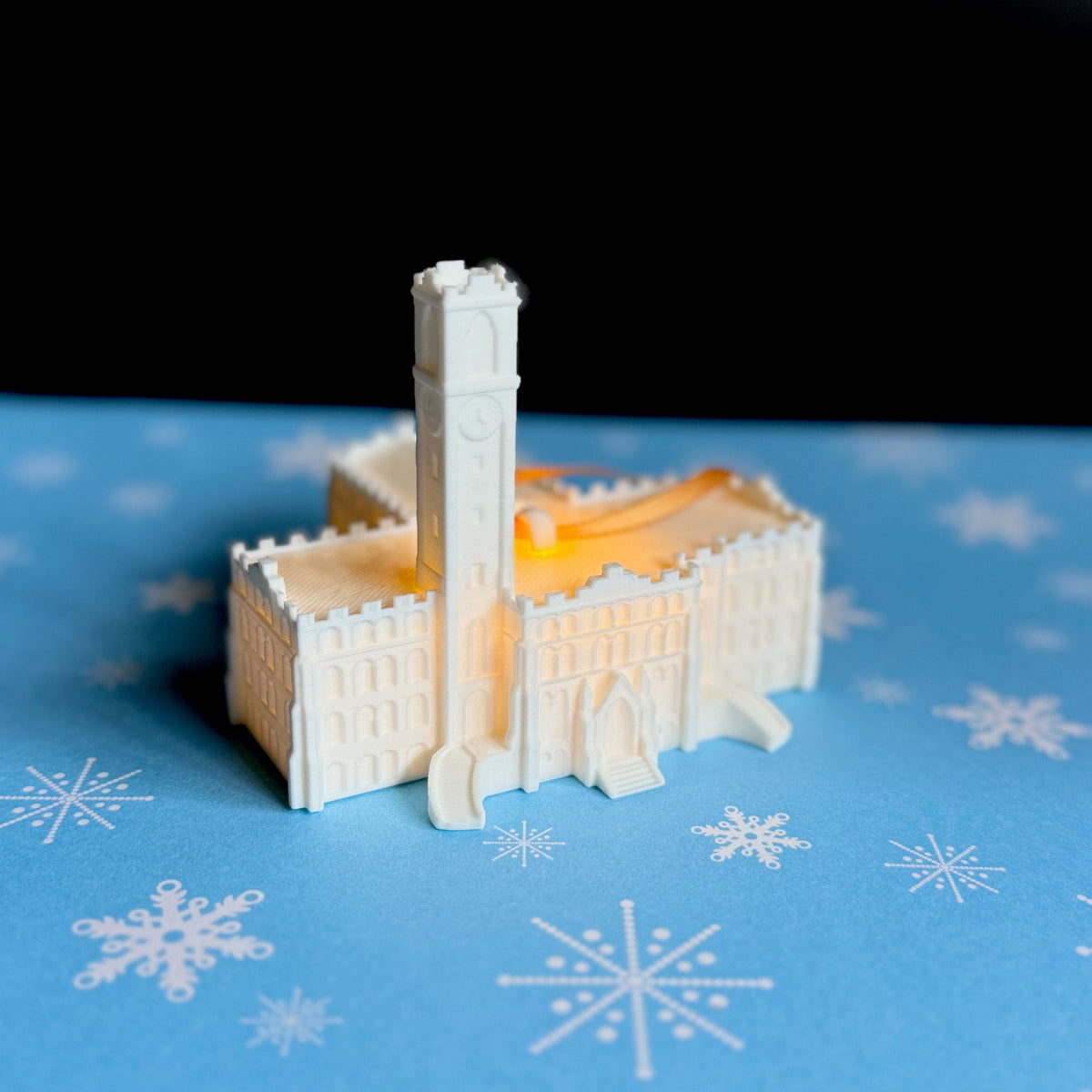 The holiday decoration for Vanderbilt University, shown against a Christmas background.