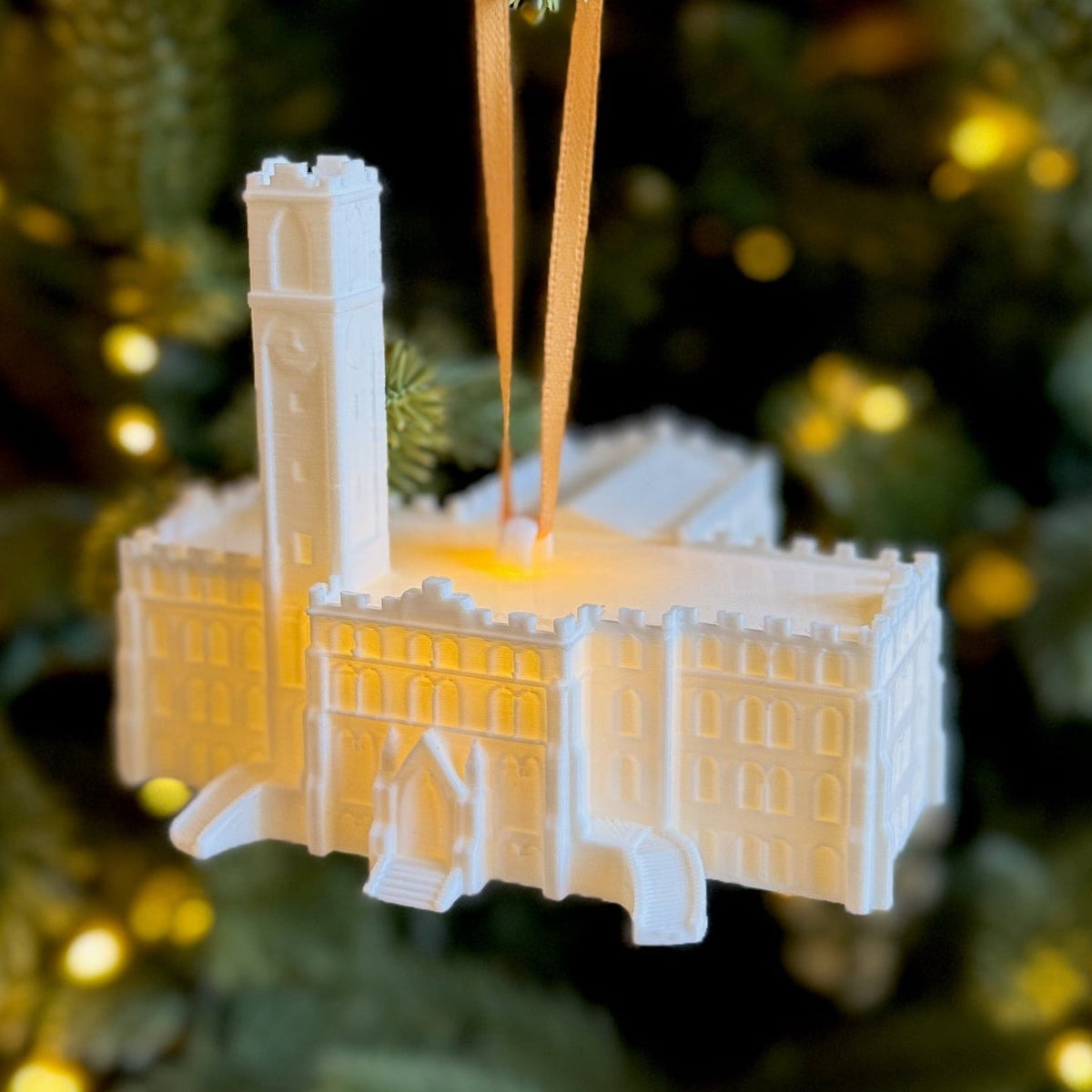 The Vanderbilt ornament depicting Kirkland Hall, shown on a Christmas tree.