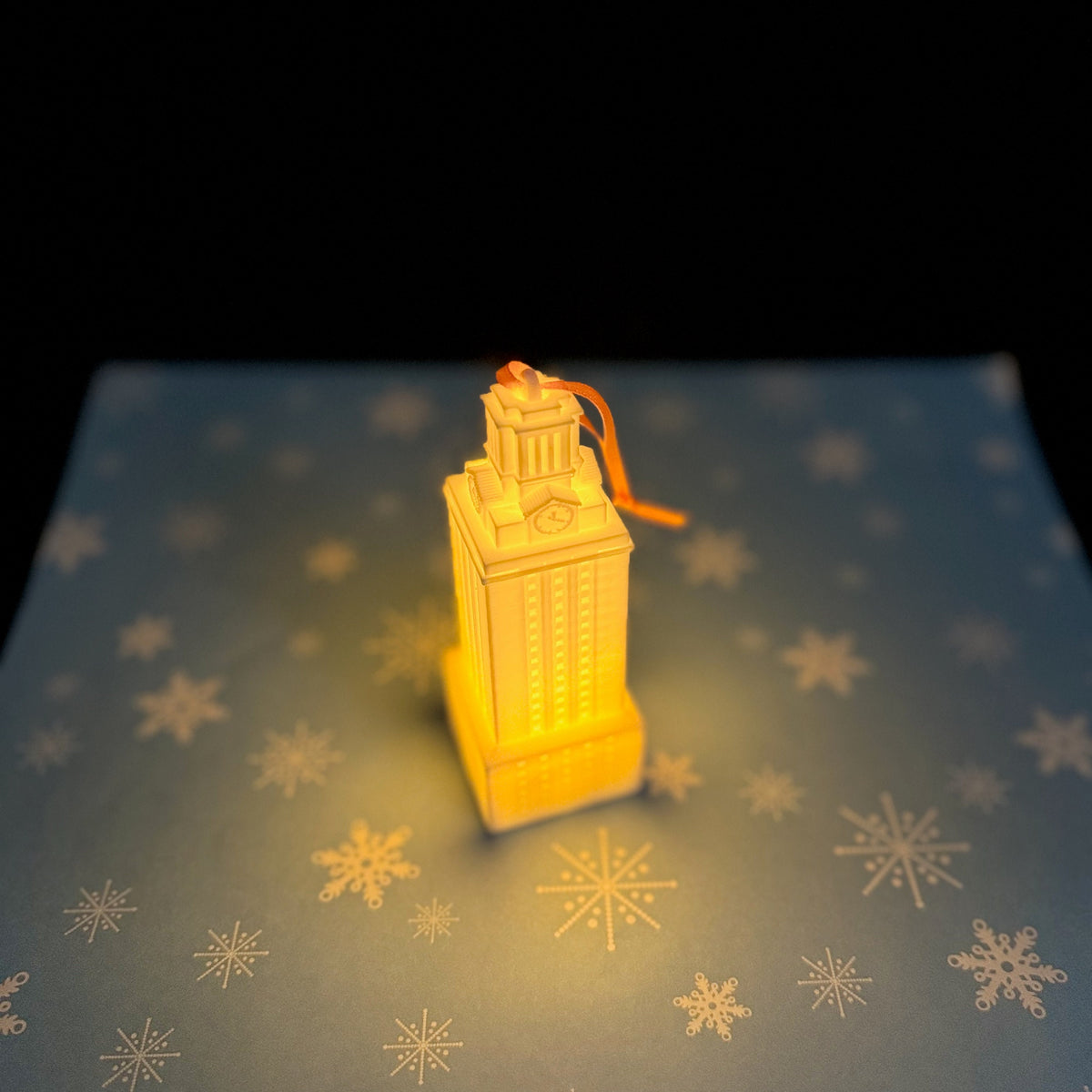 The UT Tower ornament, shown with the light turned on.