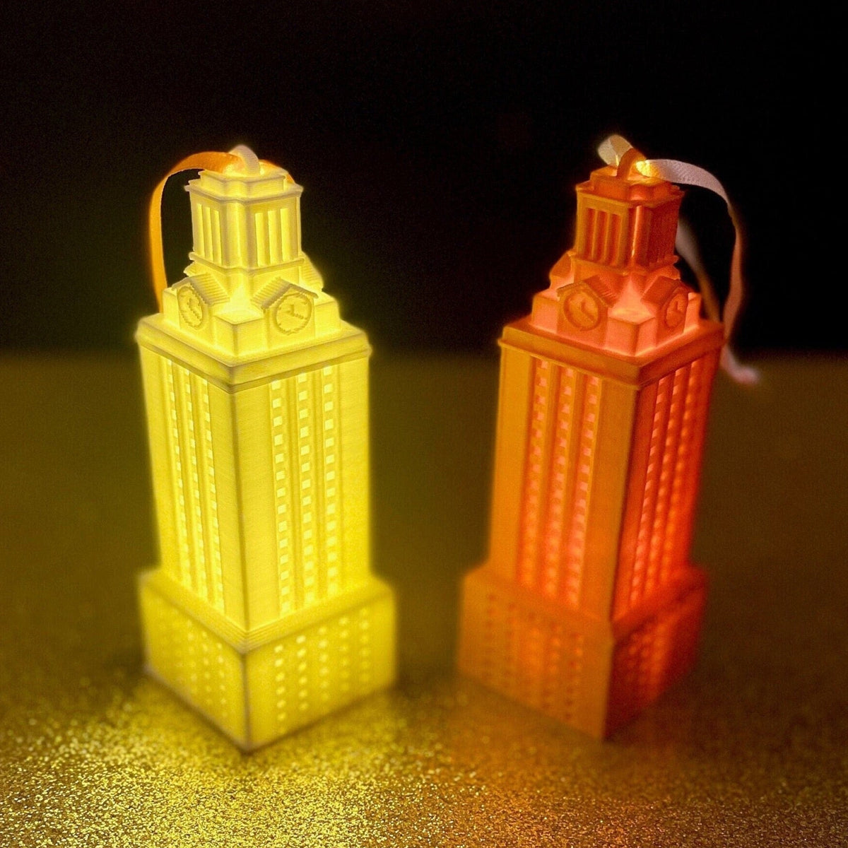 The lighted University of Texas ornaments, shown in white and burnt orange.