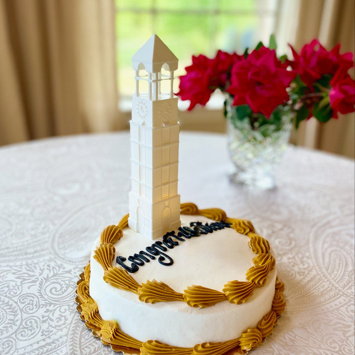 The Boilermakers cake topper, shown on a Purdue graduation cake.