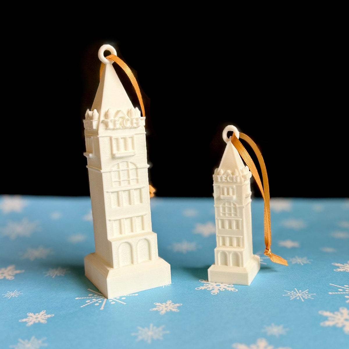 Georgia Tech Tower ornaments, shown against a Christmas background.