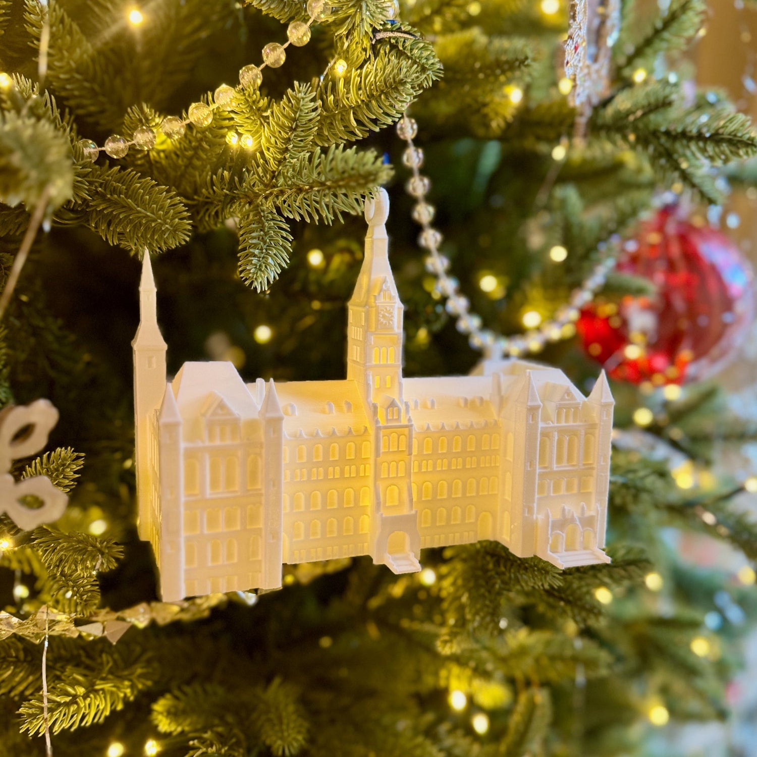 College Ornament for Georgetown alumni, featuring the Healy Hall building and shown on a Christmas tree.