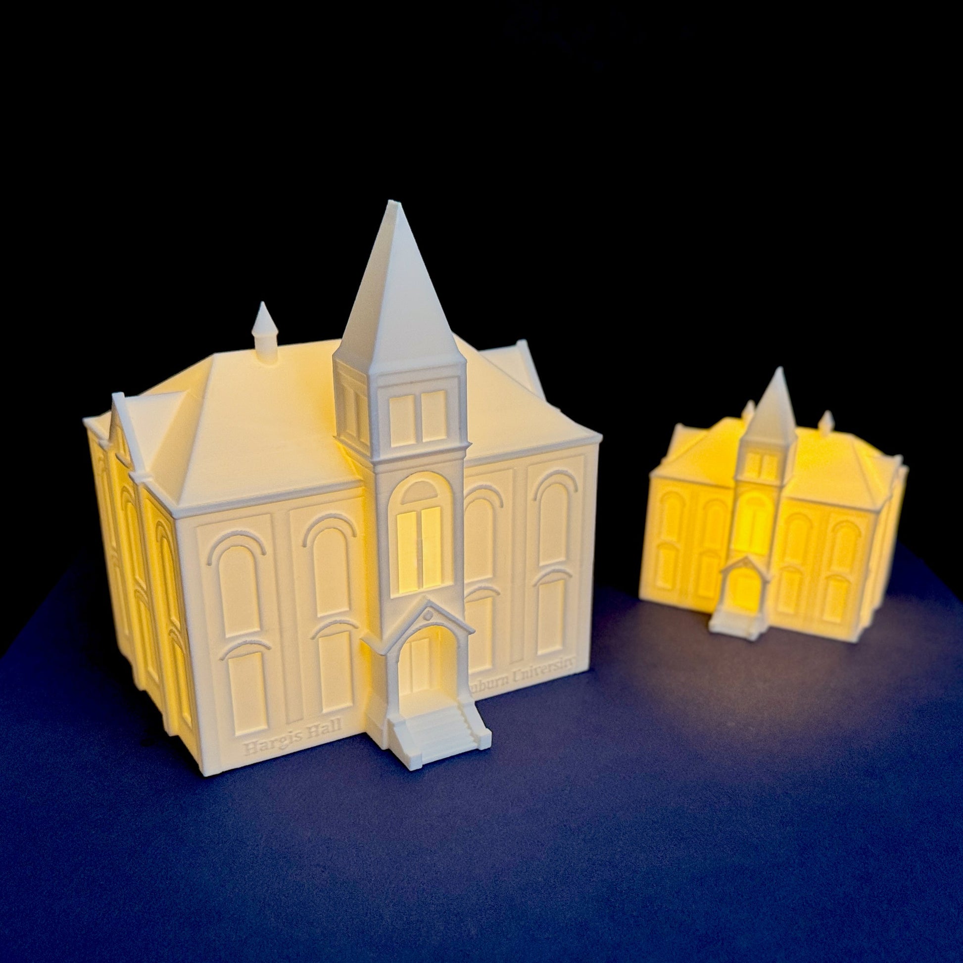 Close up of illuminated Hargis Hall Auburn architectural model with warm LED glow