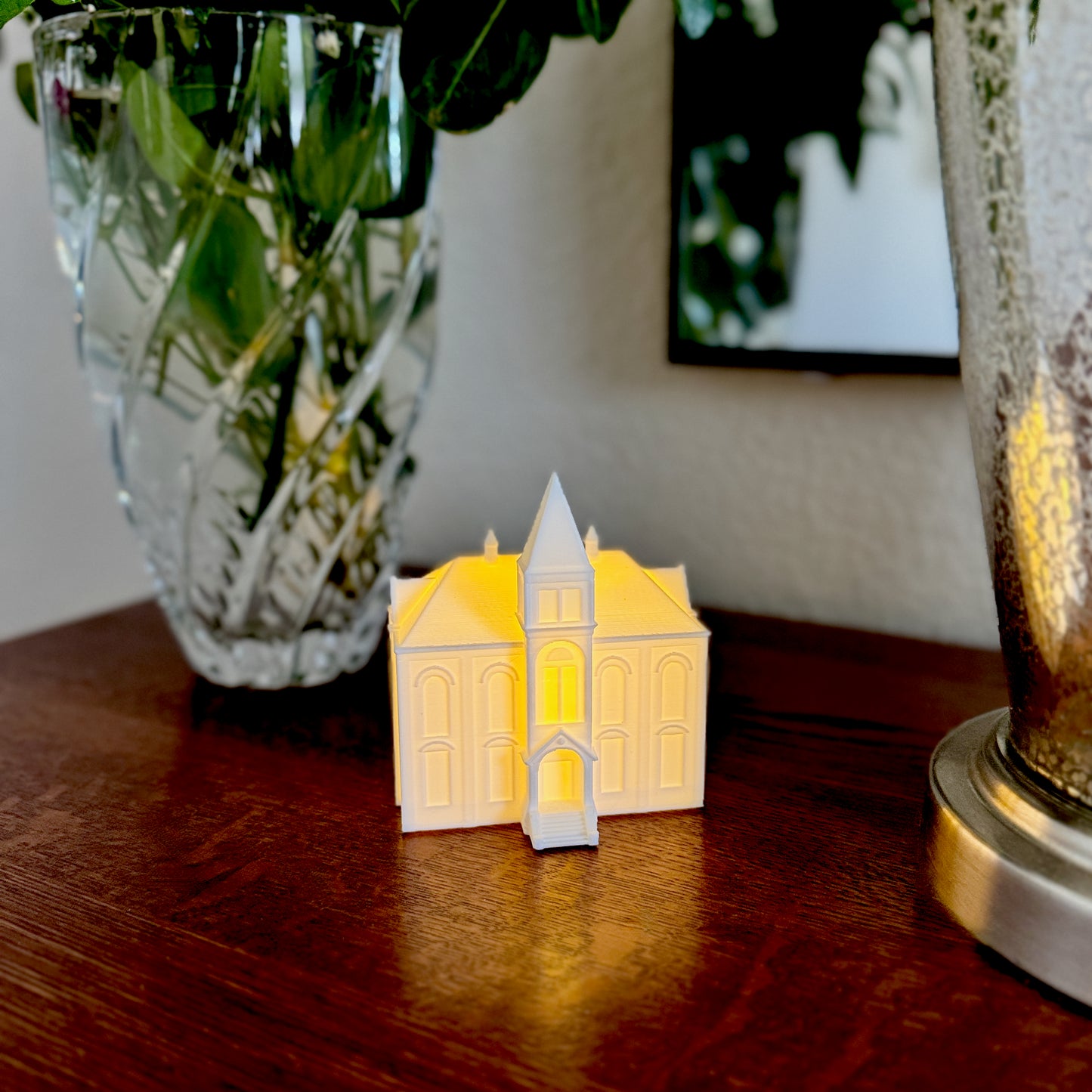 Auburn alumni office decor featuring illuminated Hargis Hall model