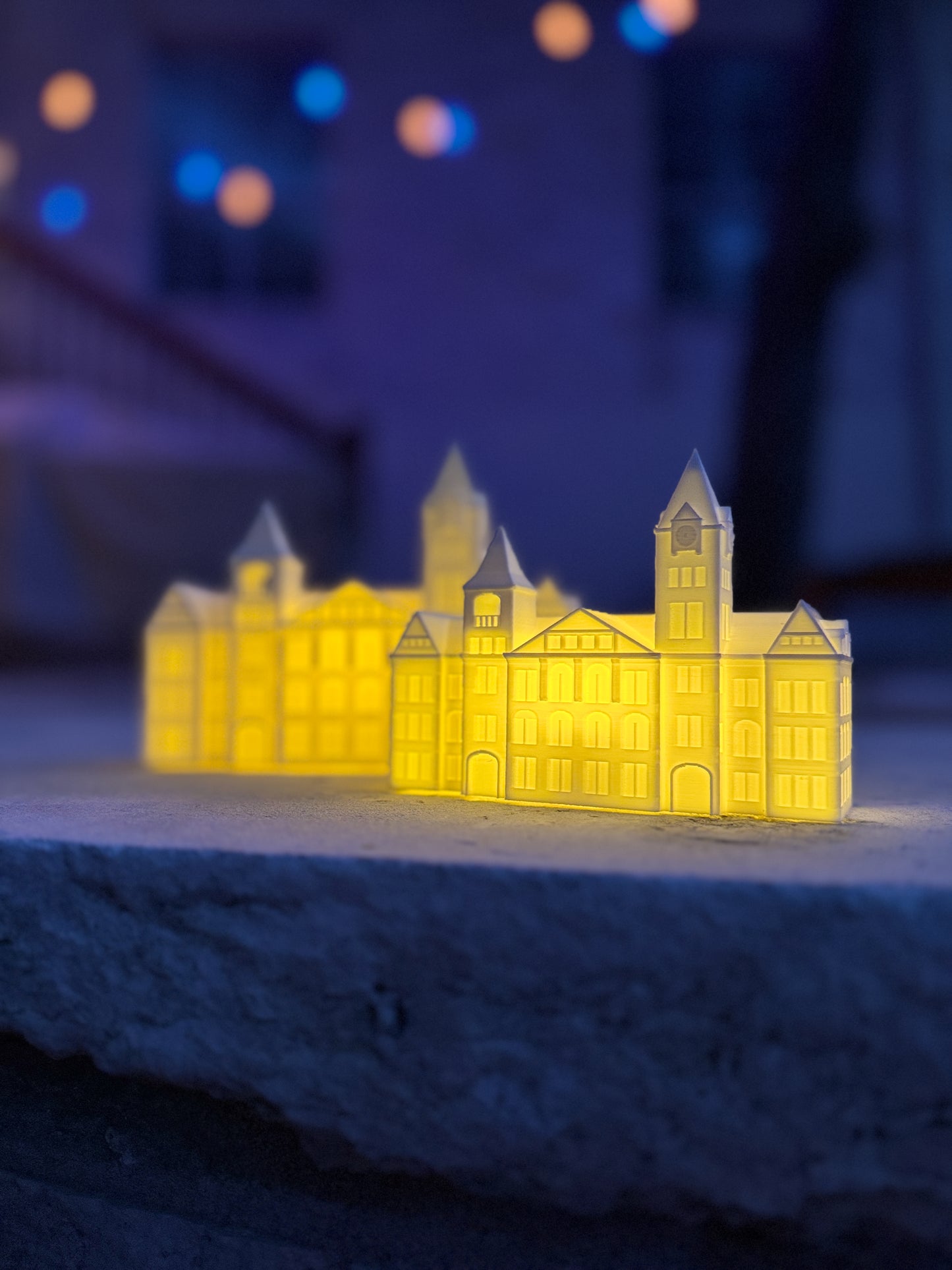 Auburn party decorations, two figurines with LED lights designed as the Samford Hall building.