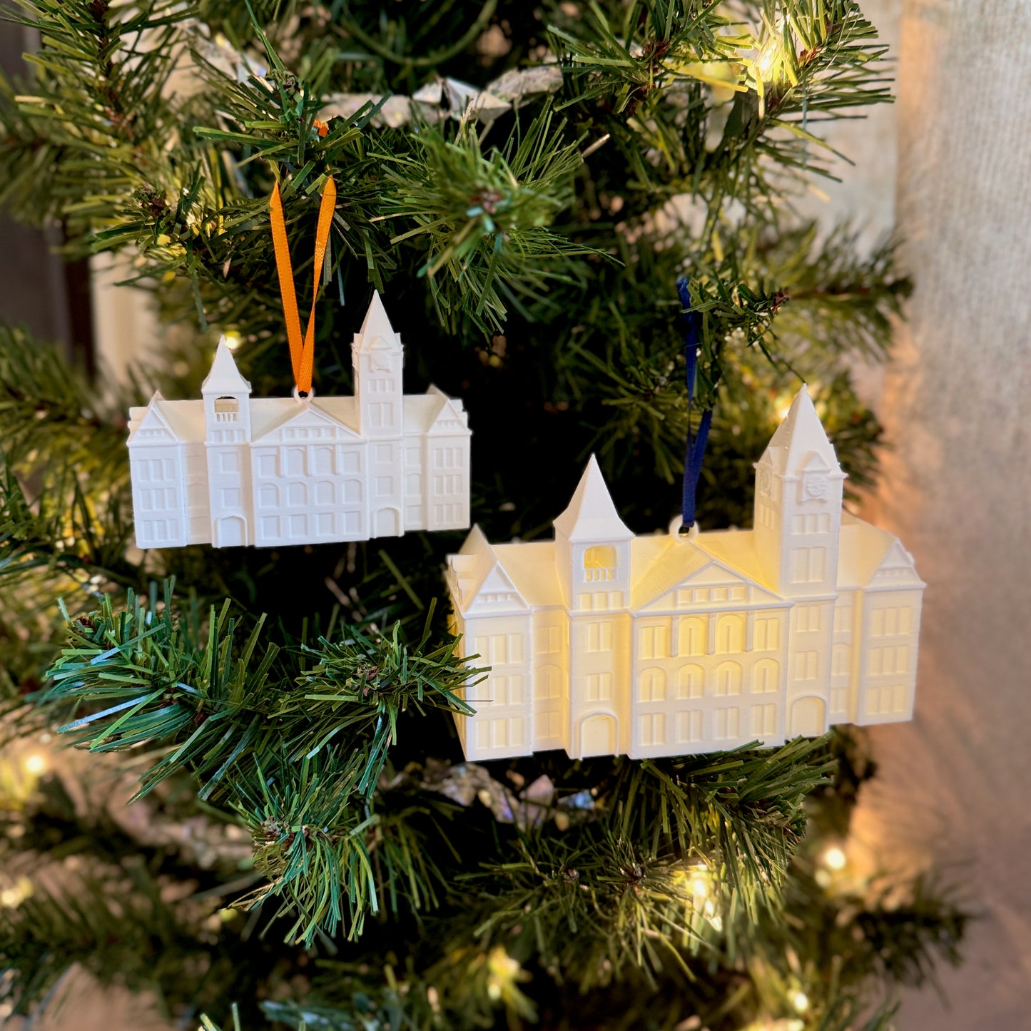 Lighted Samford Hall ornament glowing, showcasing internal LED illumination