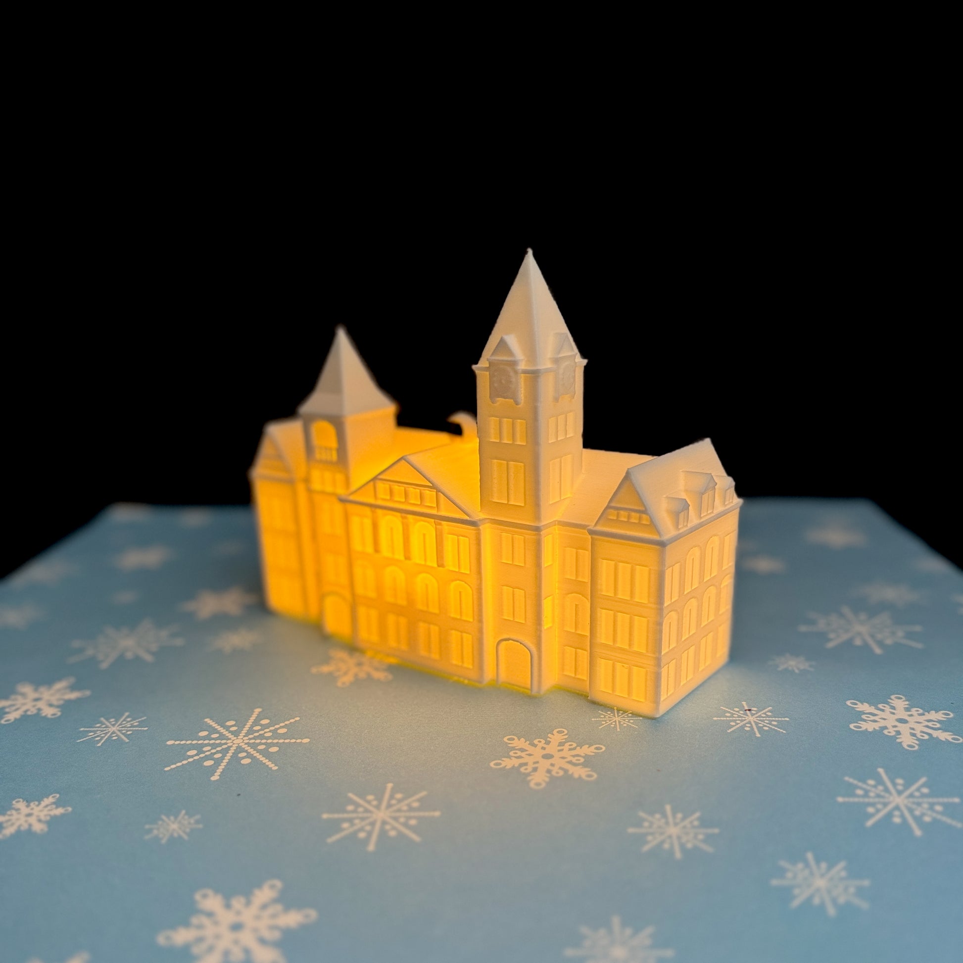 Festive Auburn Samford Hall ornament lit with warm LED glow — great gift for college students and fans.