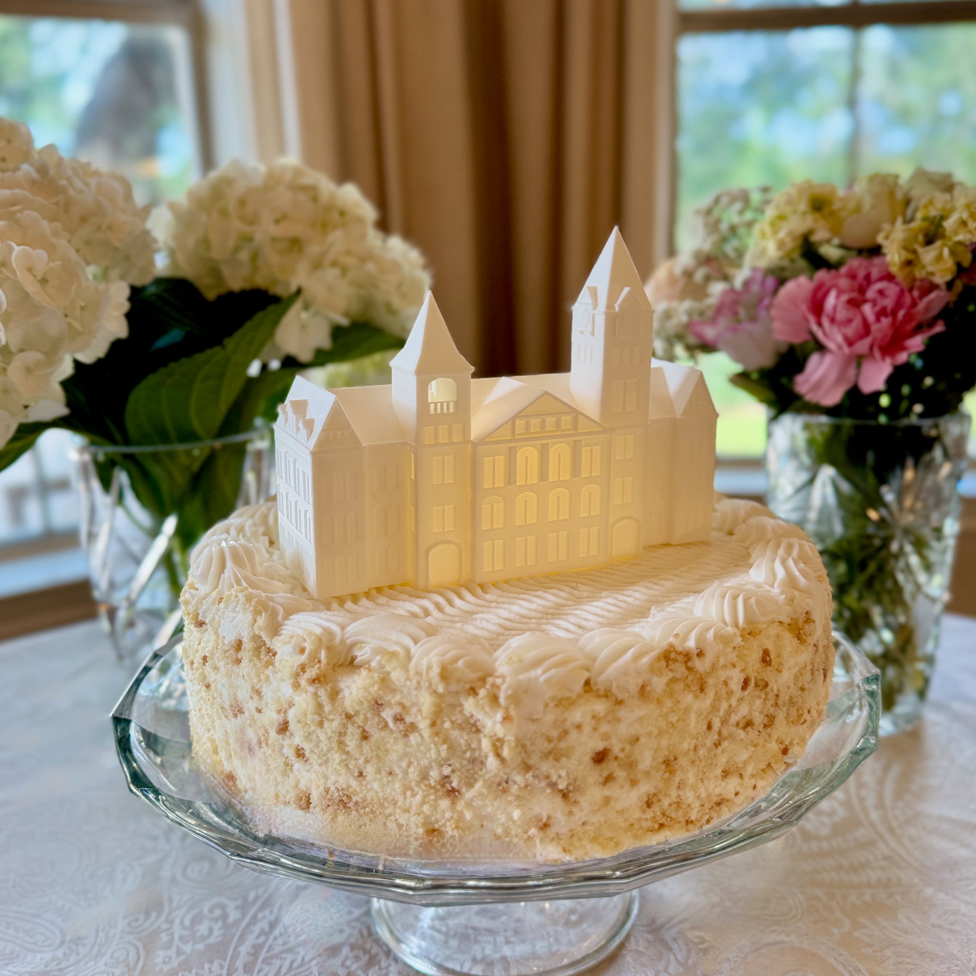Mini Auburn University clock tower figurine on graduation cake