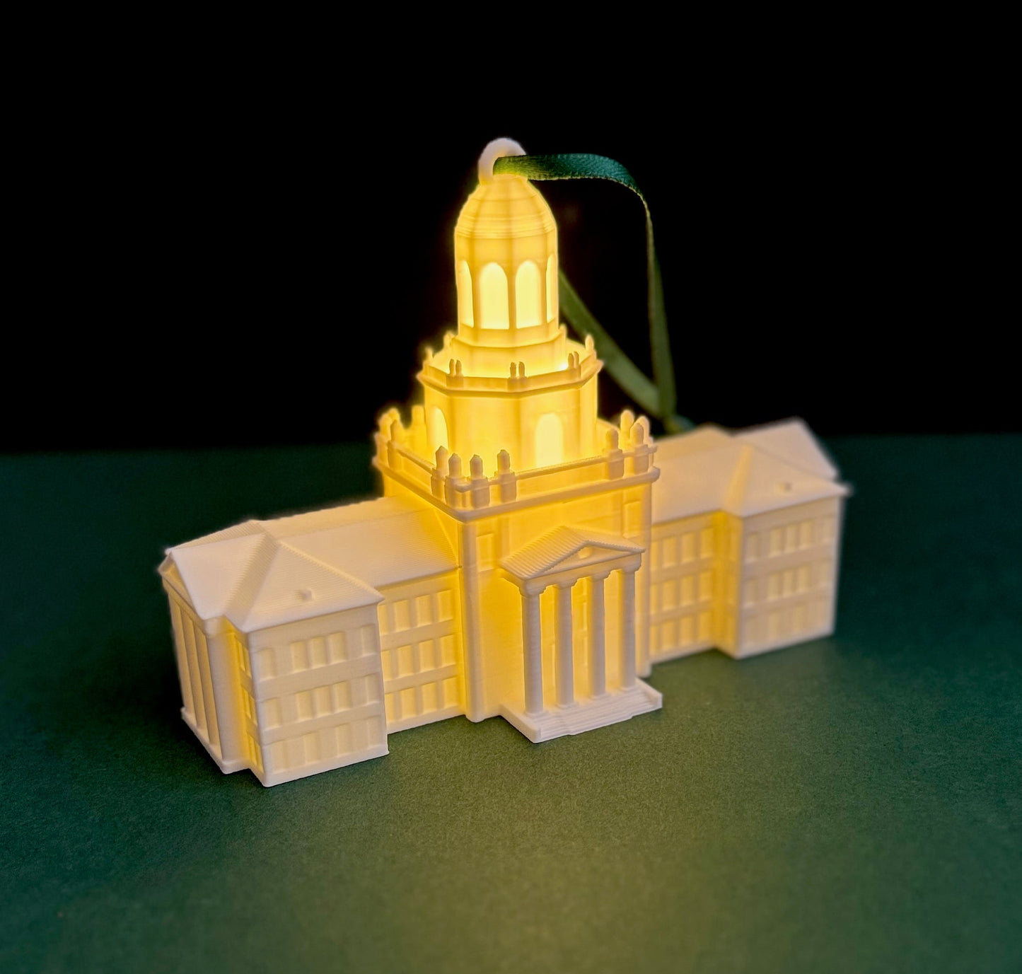 A Baylor University Ornament with an LED light, representing the Pat Neff Hall building.
