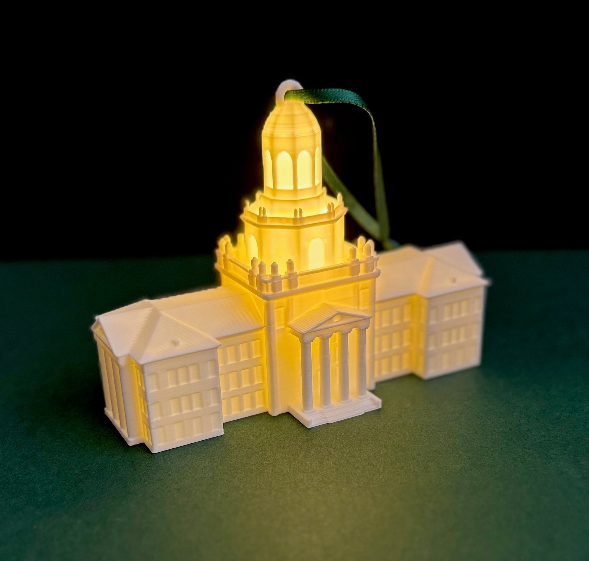 A Baylor University Ornament with an LED light, representing the Pat Neff Hall building.