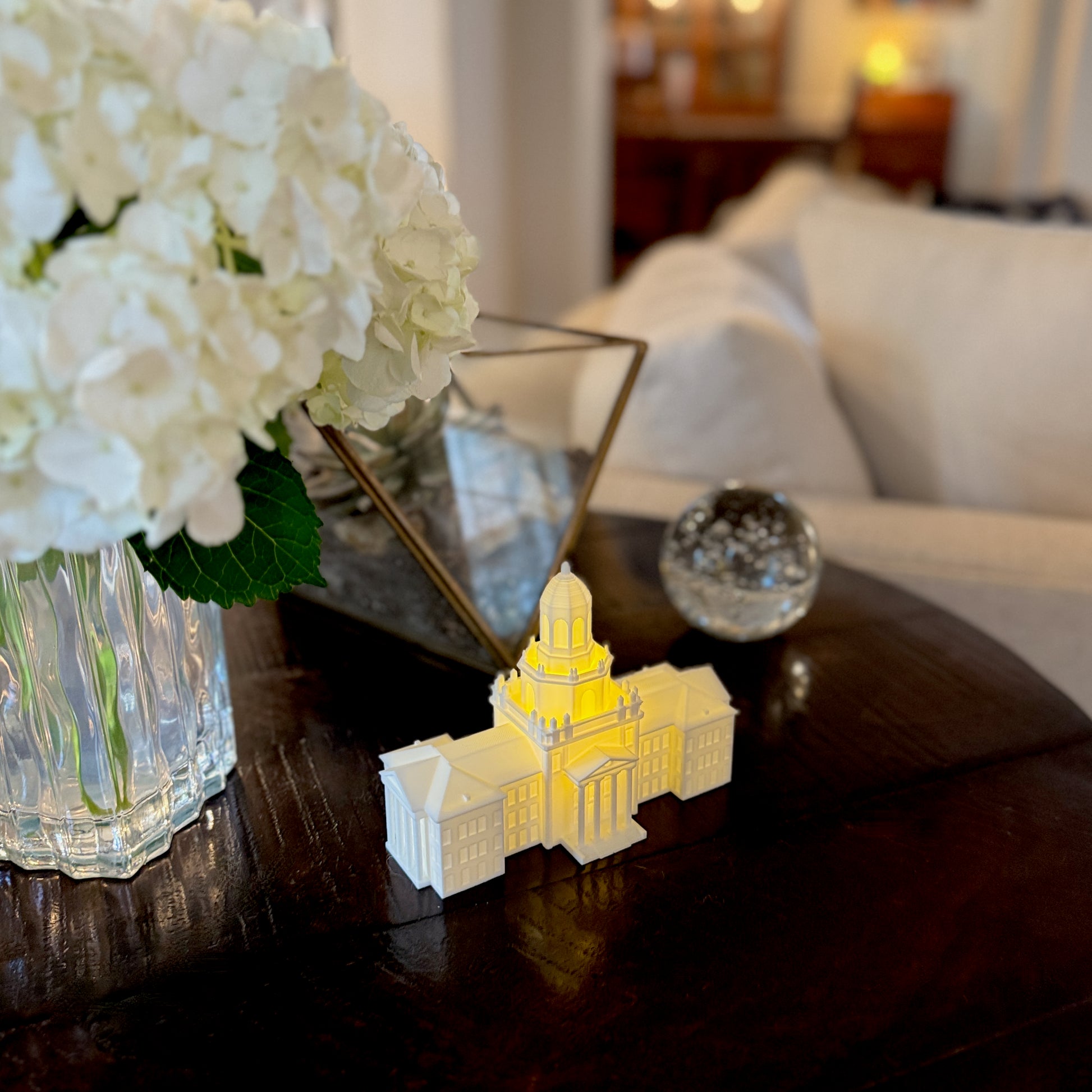White 3D printed replica of Pat Neff Hall displayed on an office desk, serving as Baylor University alumni decor.