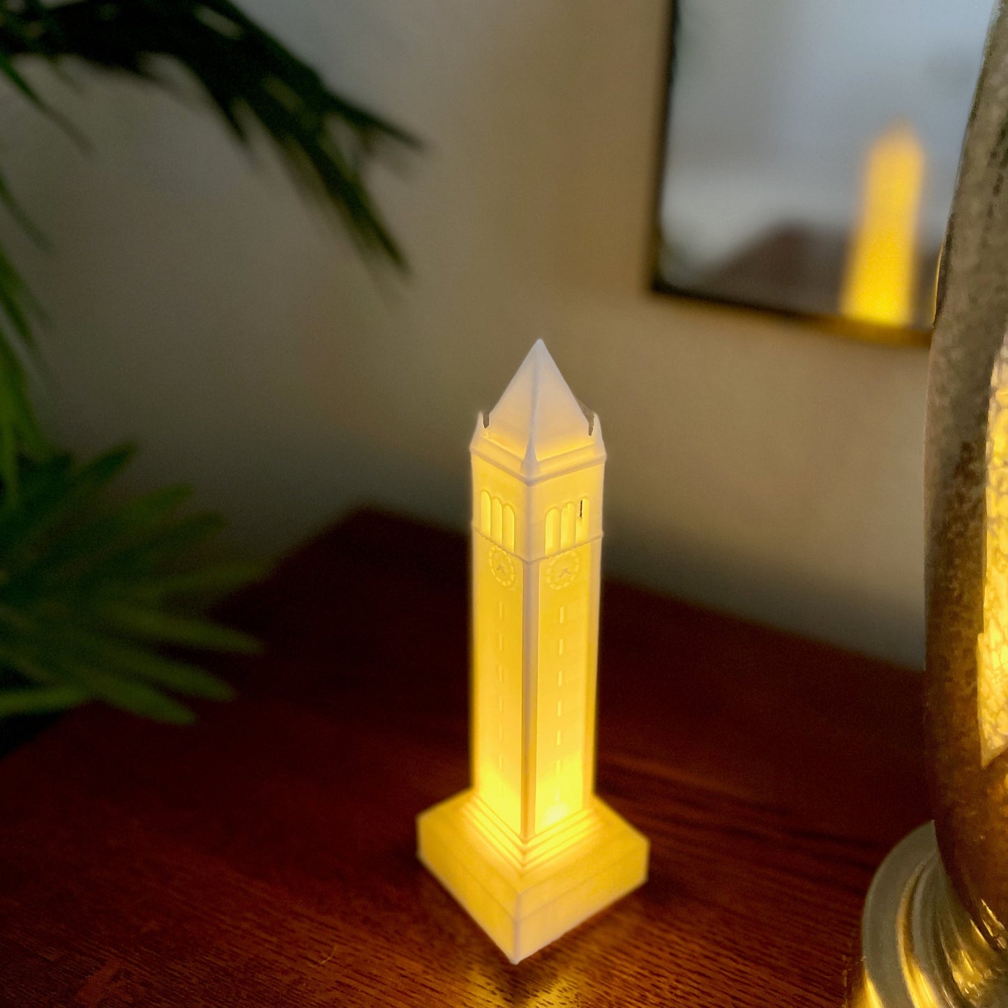 The Berkeley Campanile light used as dorm decor and shown on a side table.