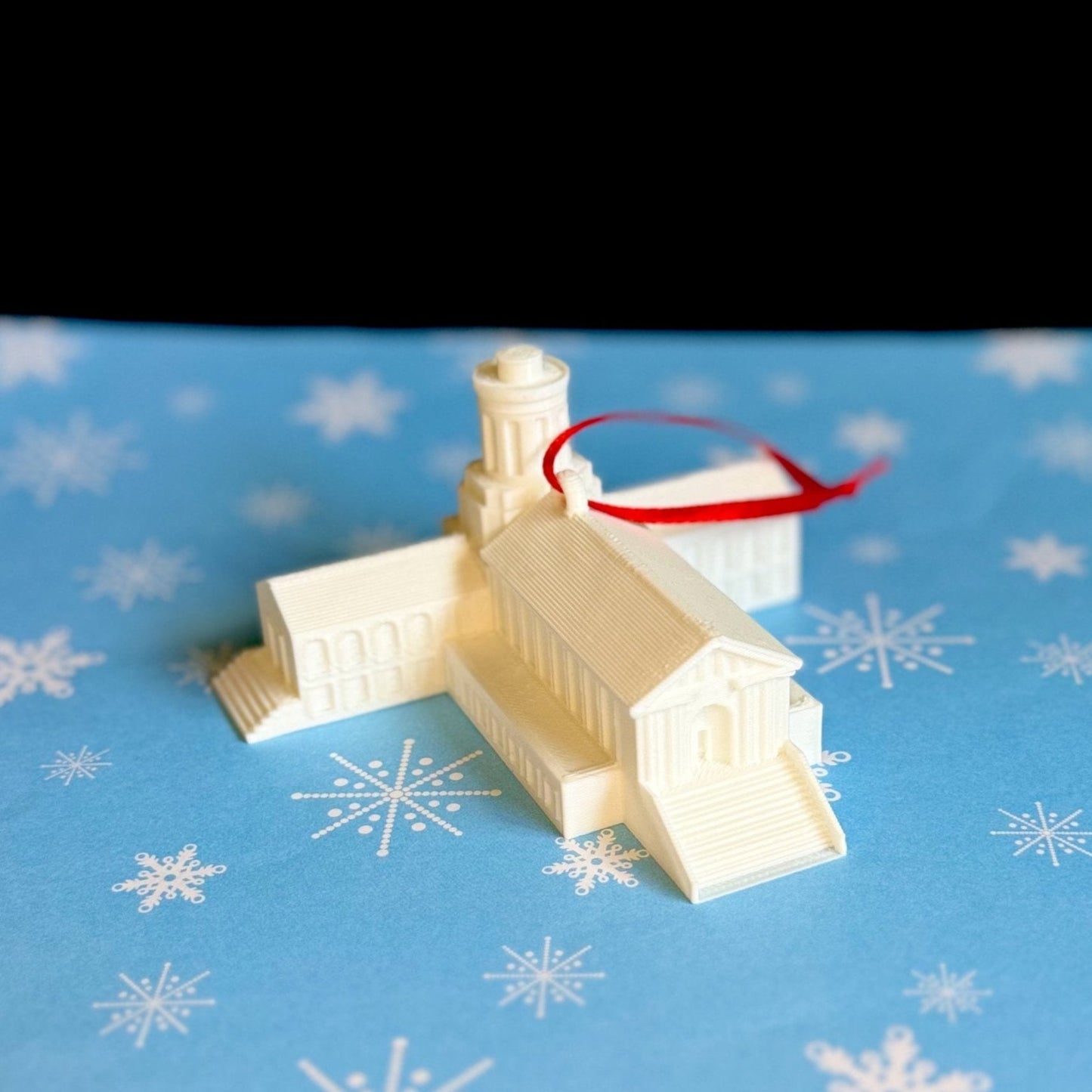 The Carnegie Mellon Ornament, shown against a holiday background.