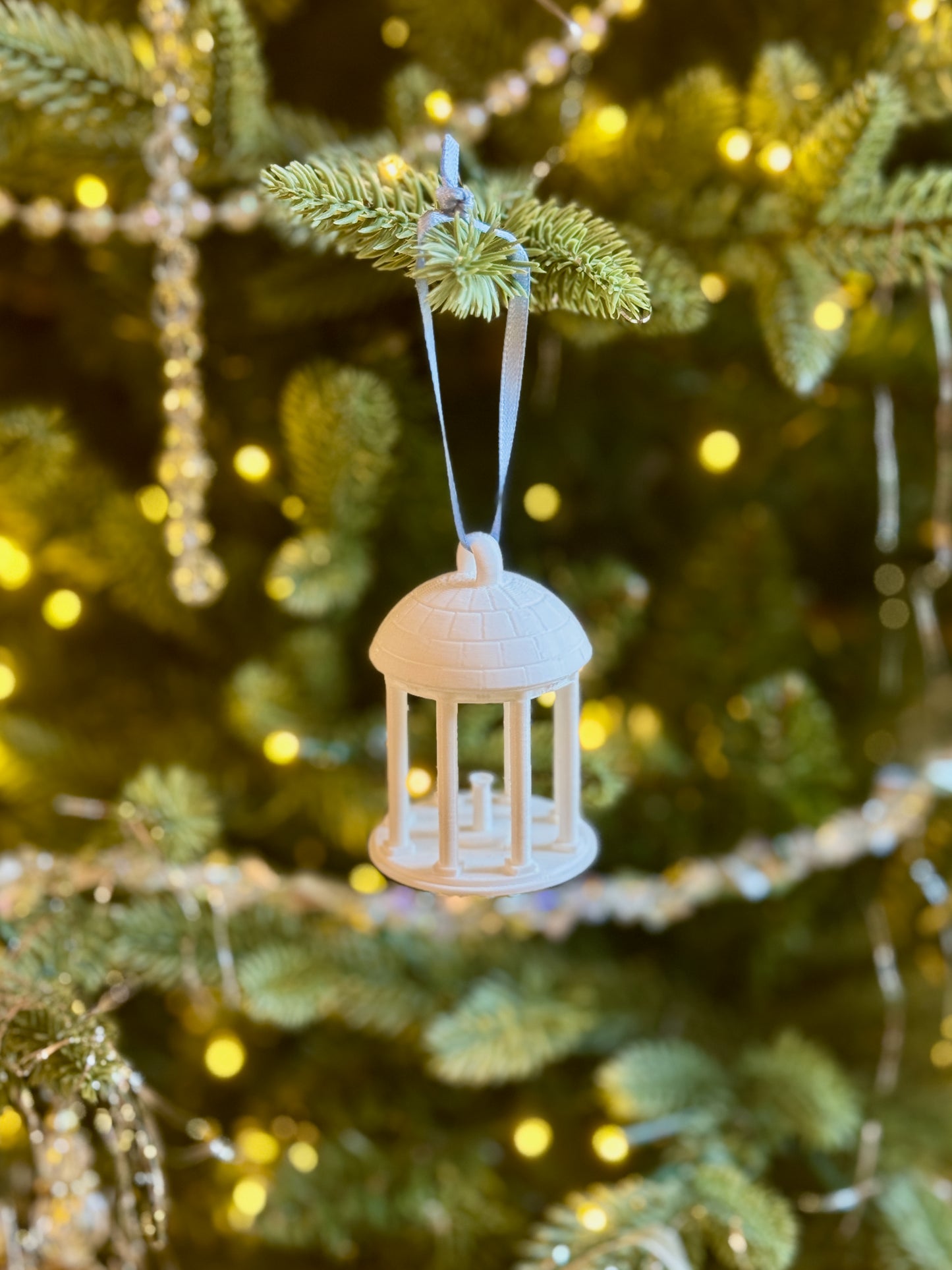 A Christmas ornament for UNC students designed as the Old Well on the Chapel Hill campus.