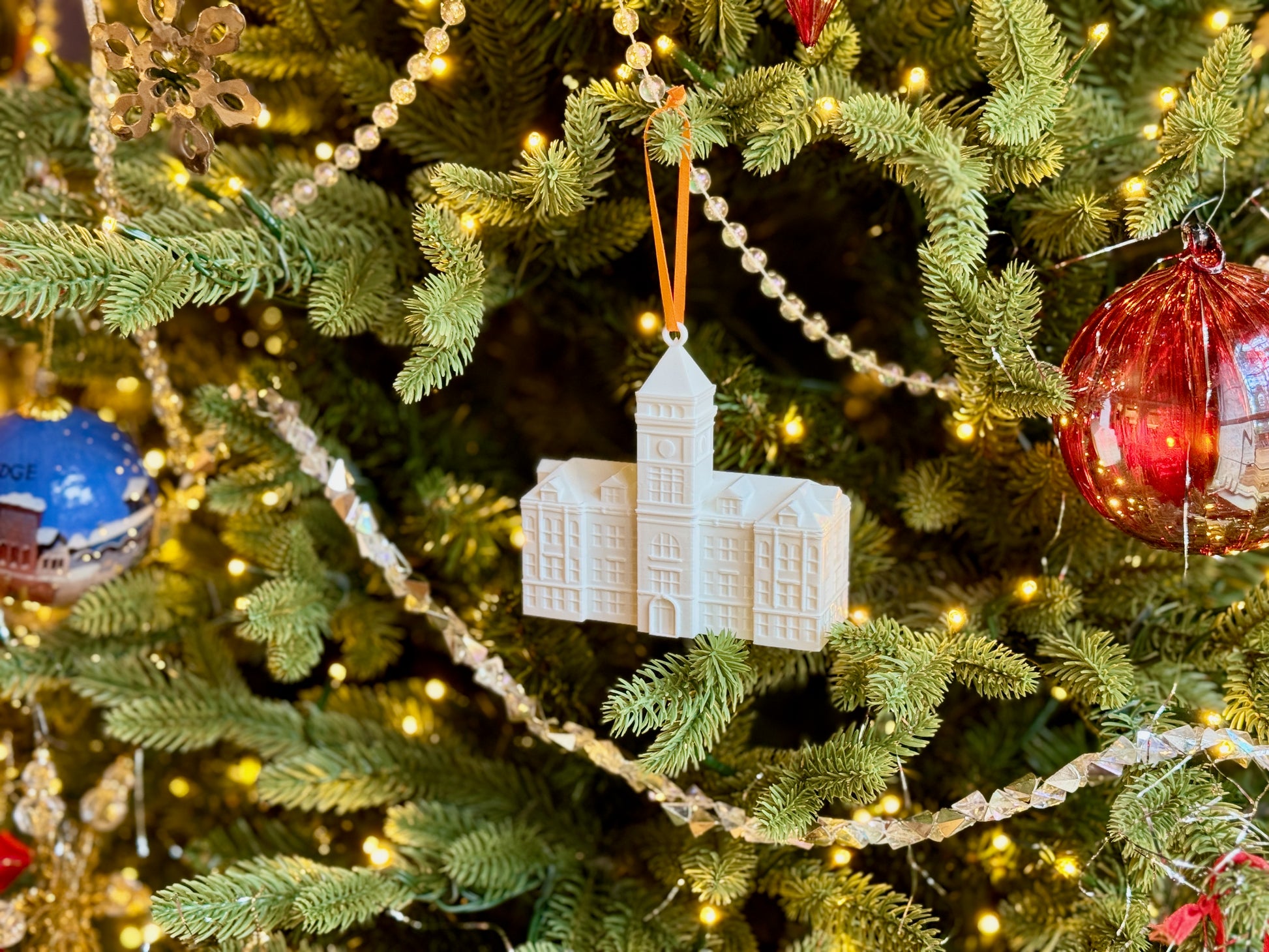 Clemson alumni ornament shown on a Christmas tree.