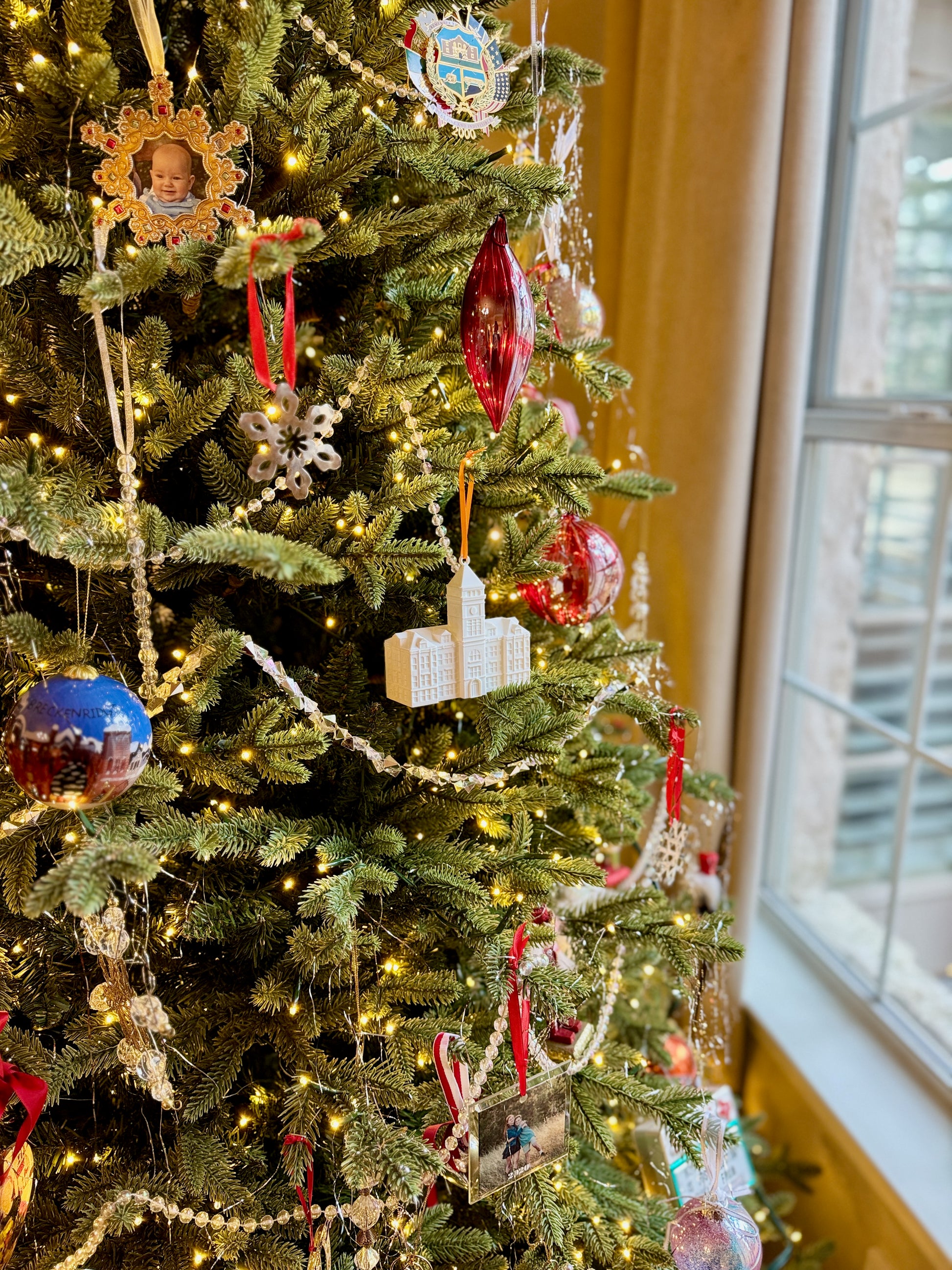 Clemson alumni ornament shown on a Christmas tree.