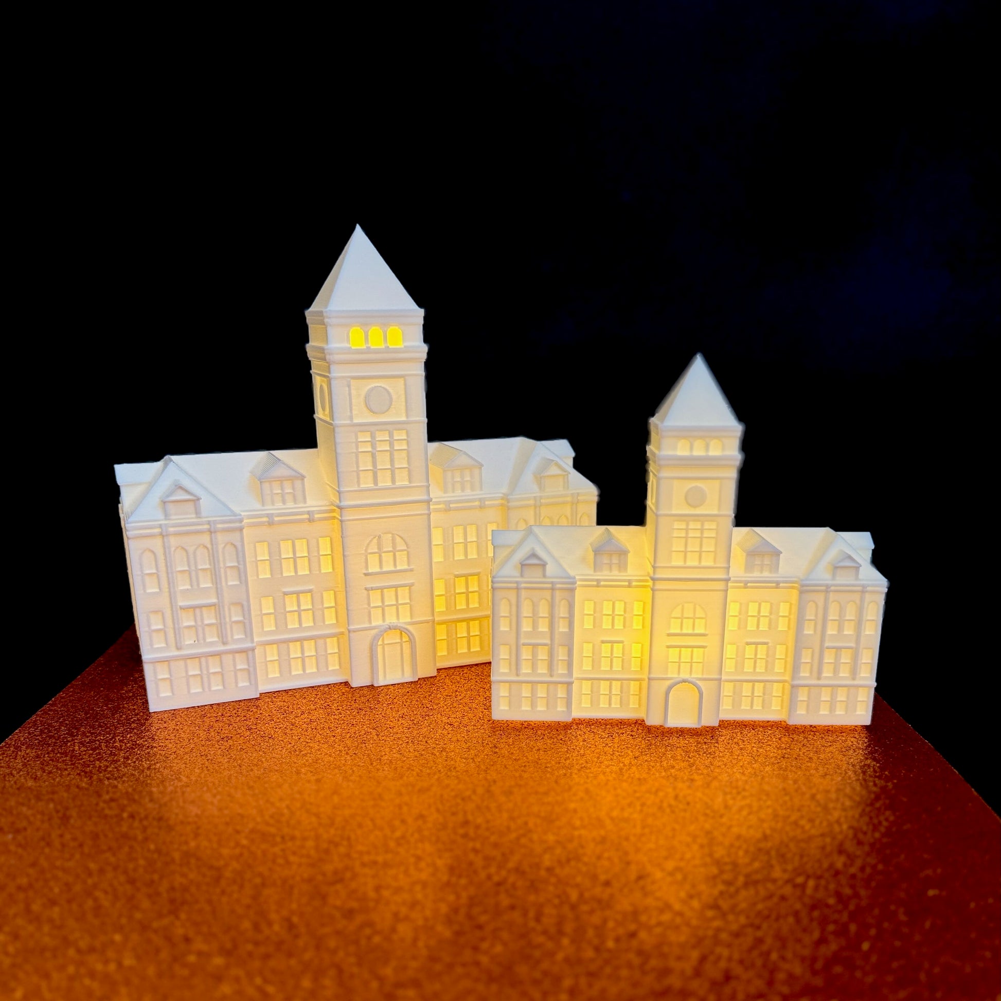 The large and small Clemson Tillman Hall figurines, shown side by side.