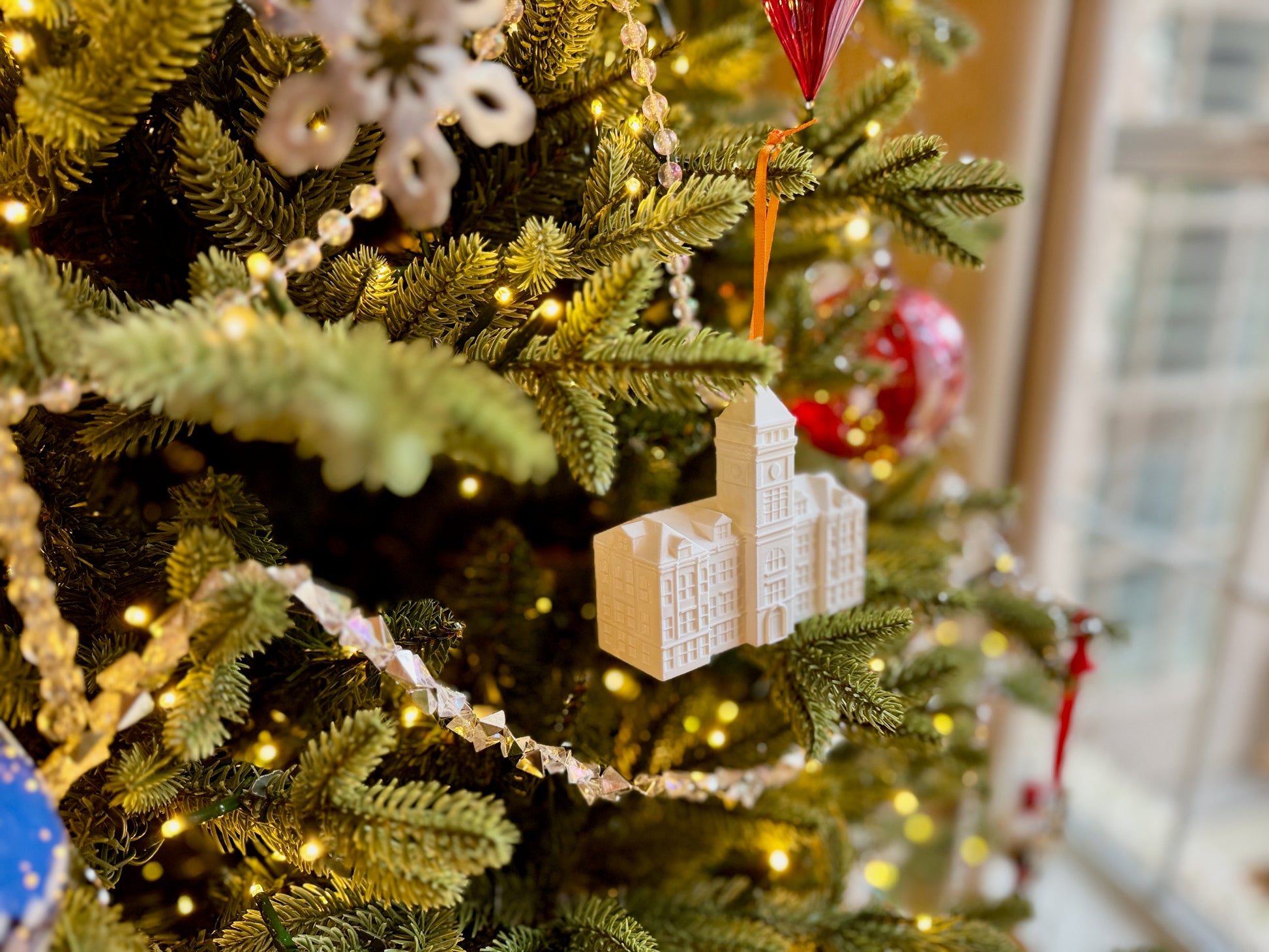 The Clemson graduation ornament shown on a Christmas tree.