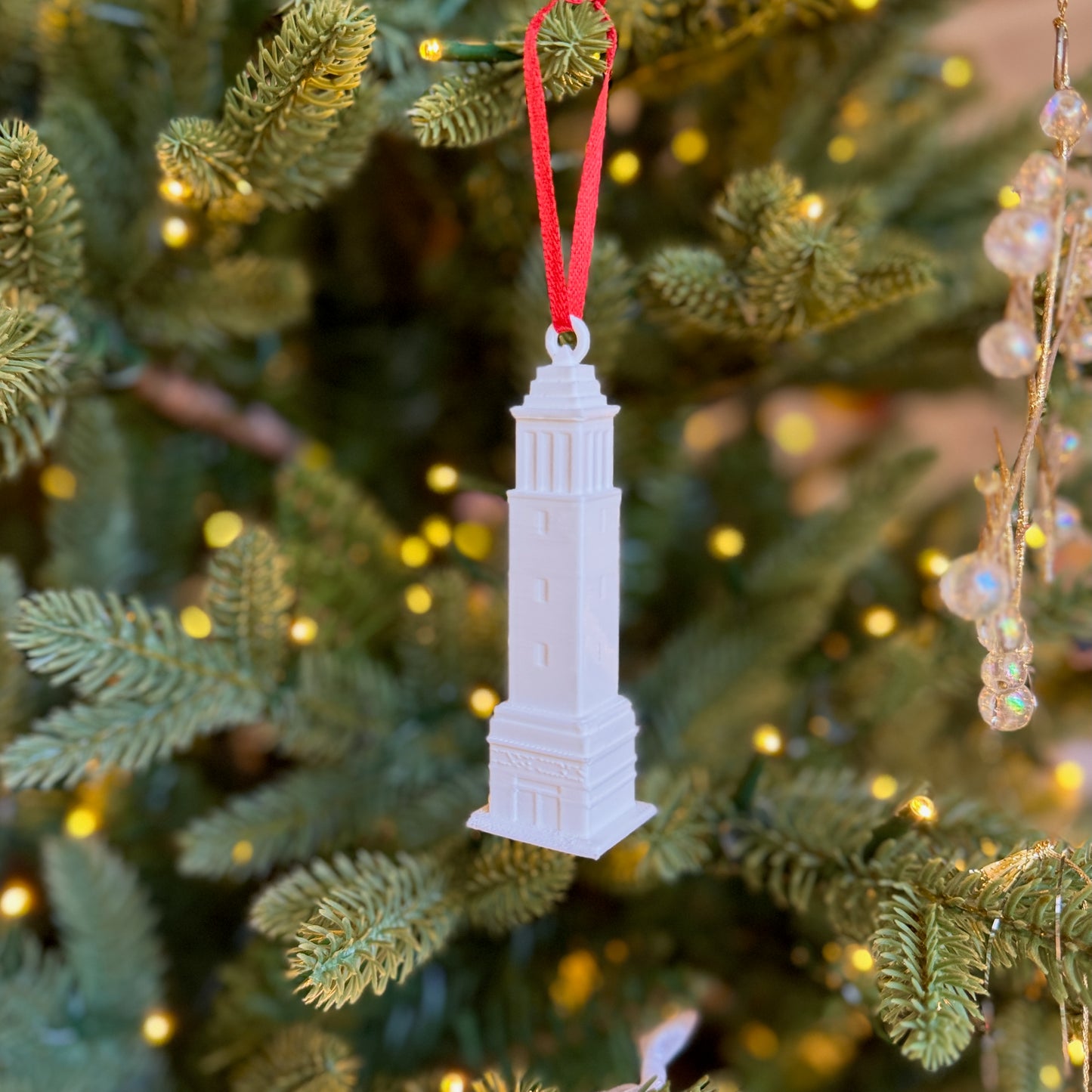 The Denny Chimes ornament shown on an Alabama tree.