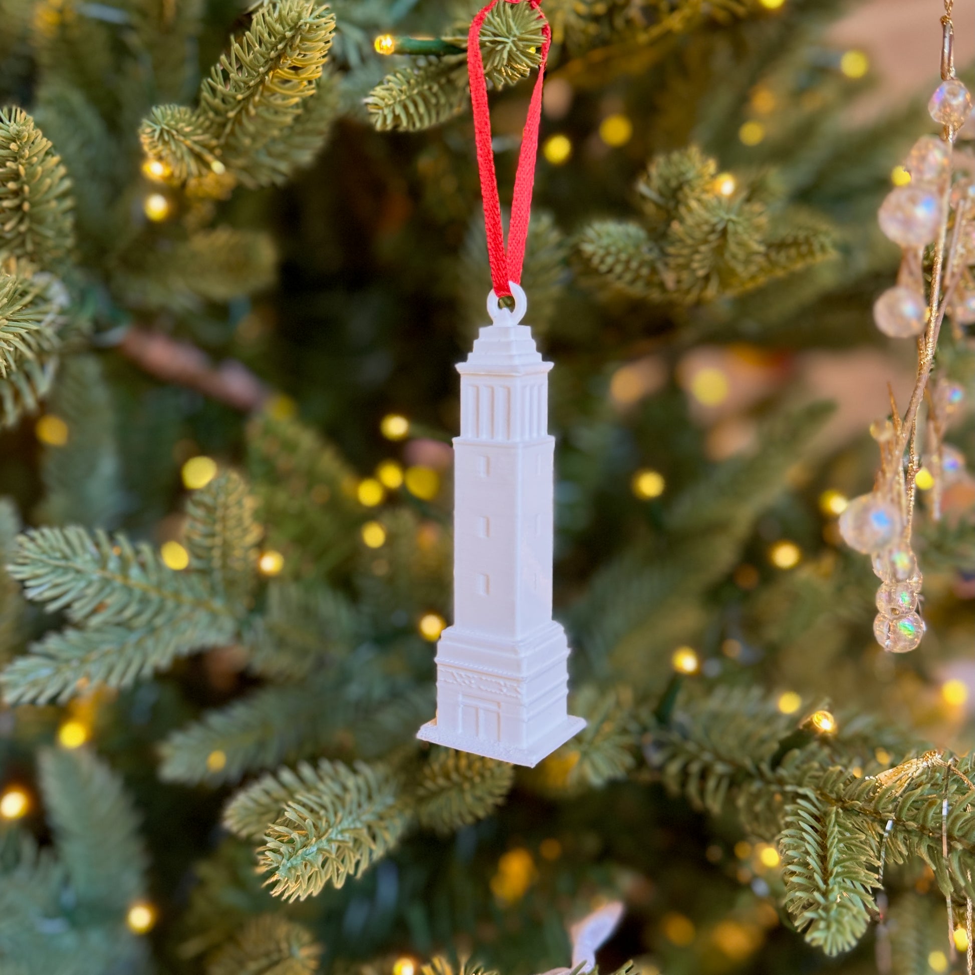 The Denny Chimes ornament shown on an Alabama tree.