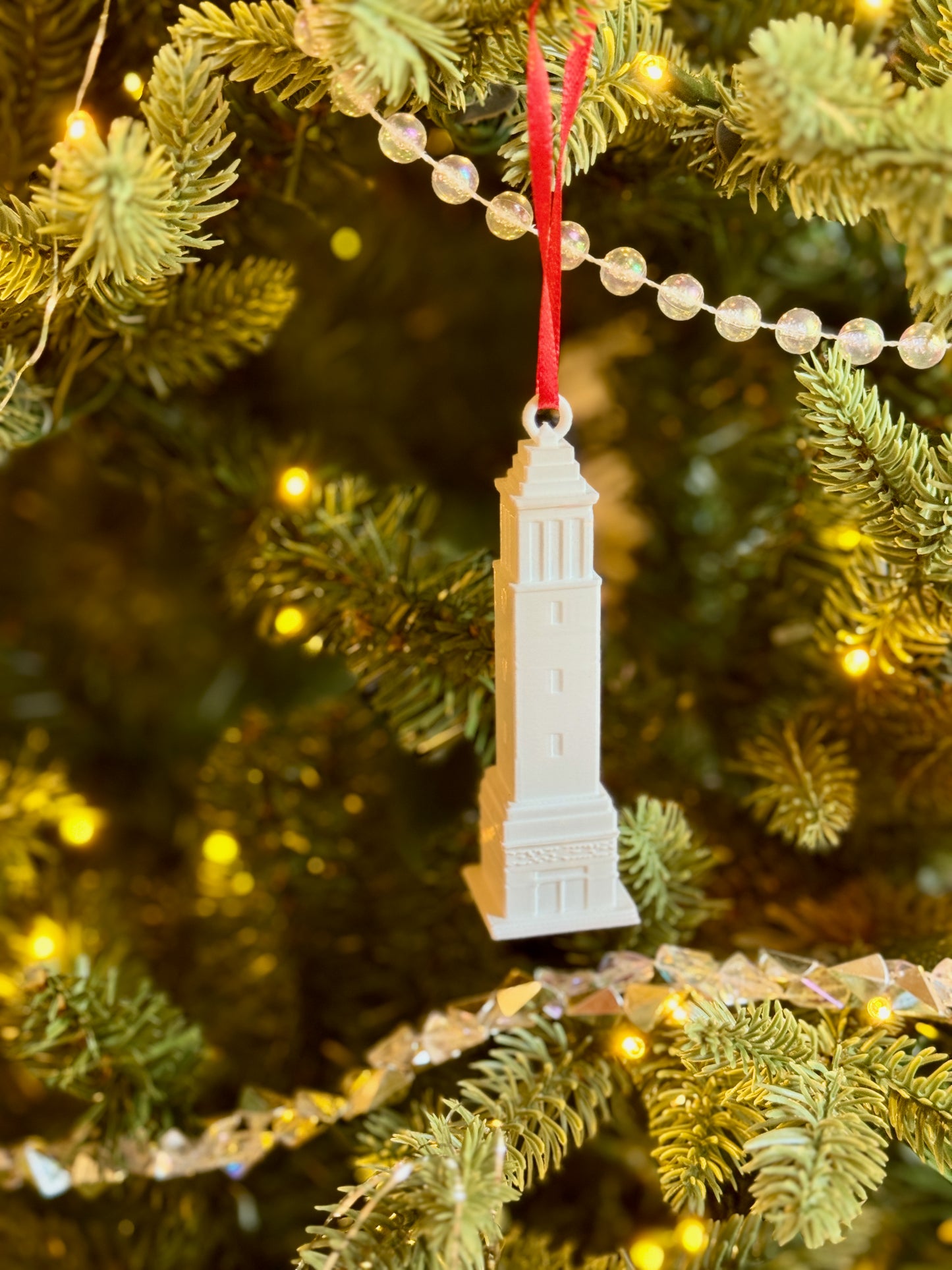 Denny Chimes ornament for Bama fans, shown on a Christmas tree.