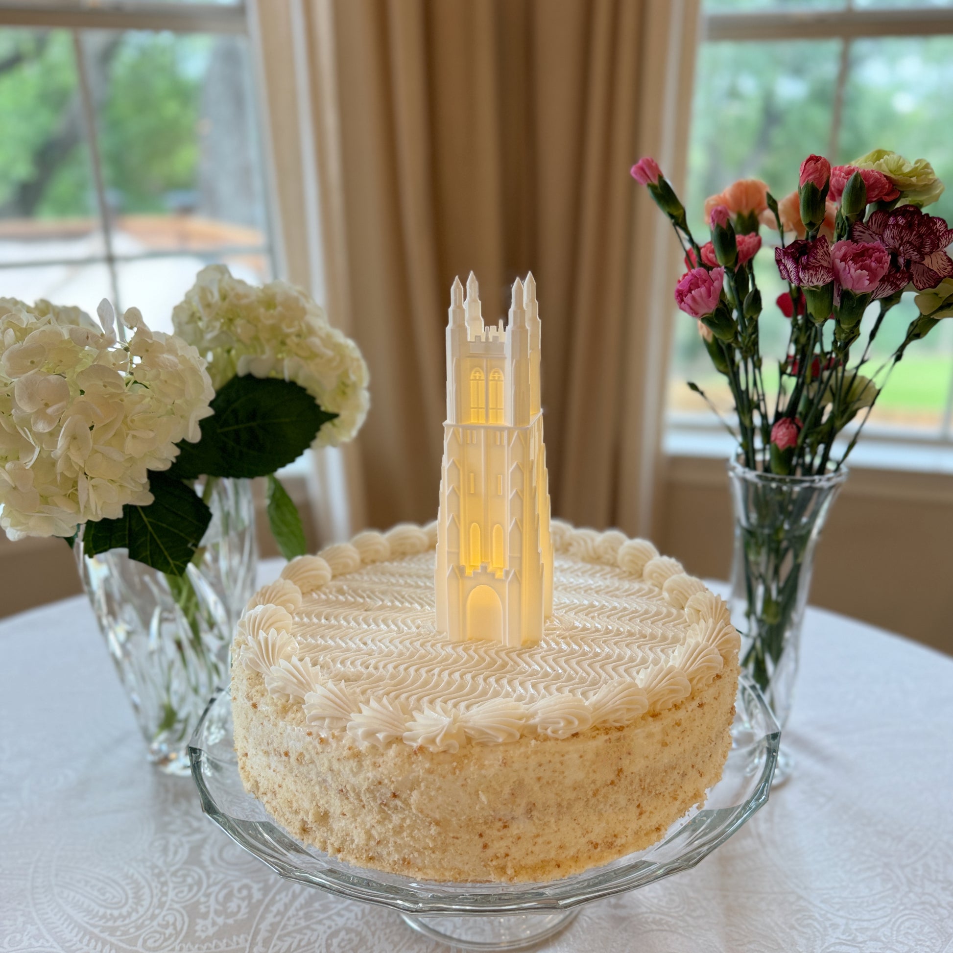 The Duke cake topper, shown on a graduation cake.