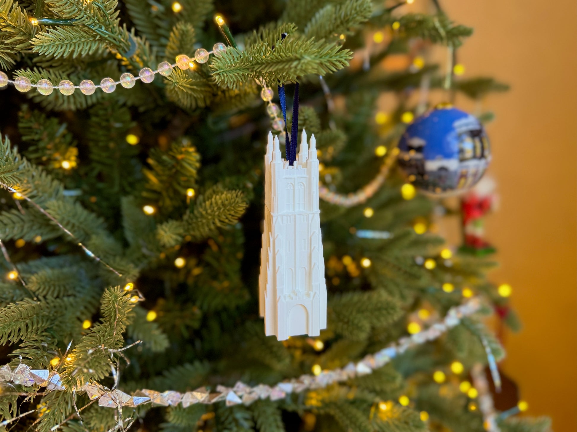 The Duke Chapel ornament for alumni, shown on a Christmas tree.