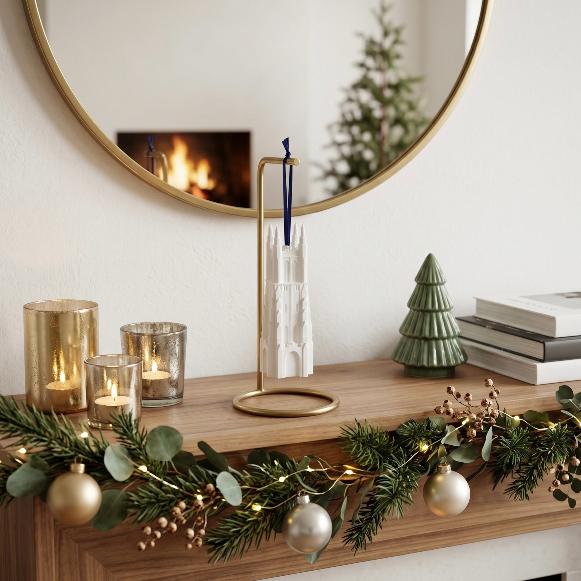 The Duke University ornament shown on a mantle decorated for Christmas and used as a display piece.