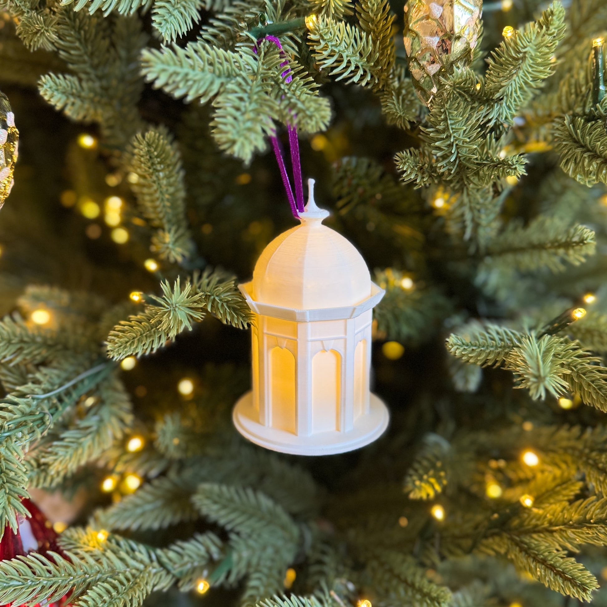 The East Carolina university ornament, shown on a Christmas tree decorated for the Holidays.