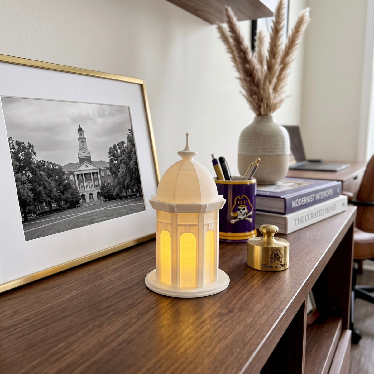 The ECU Cupola light, shown on a shelf in the office of an East Carolina University alumni.